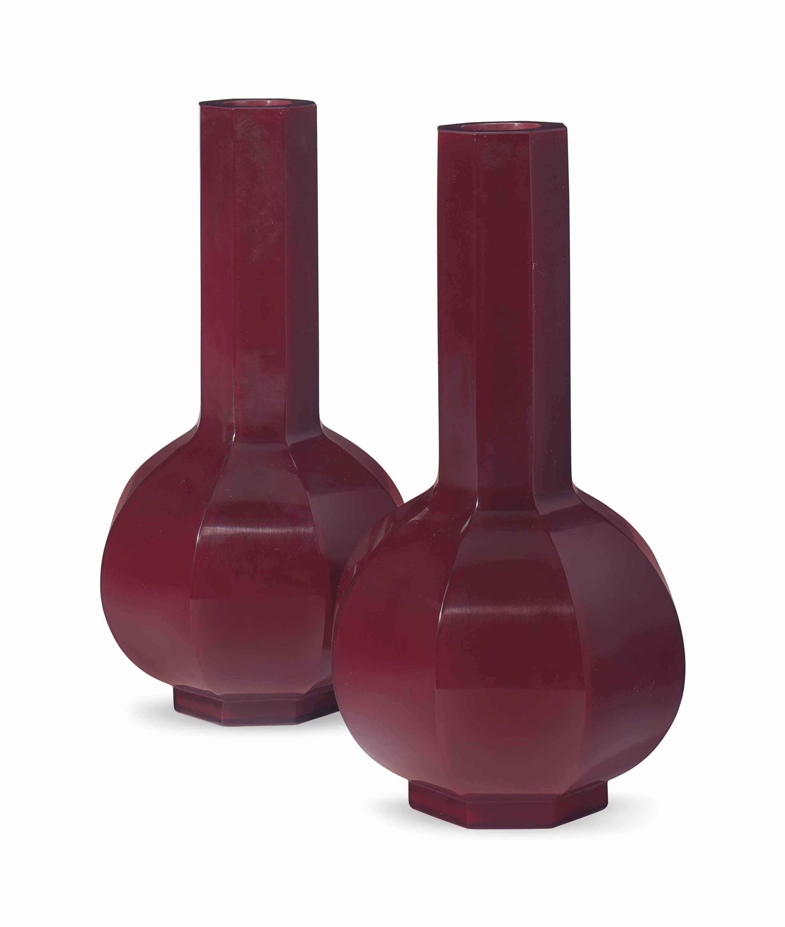 A PAIR OF RED PEKING GLASS OCTAGONAL BOTTLE VASES , LATE 19TH/20TH