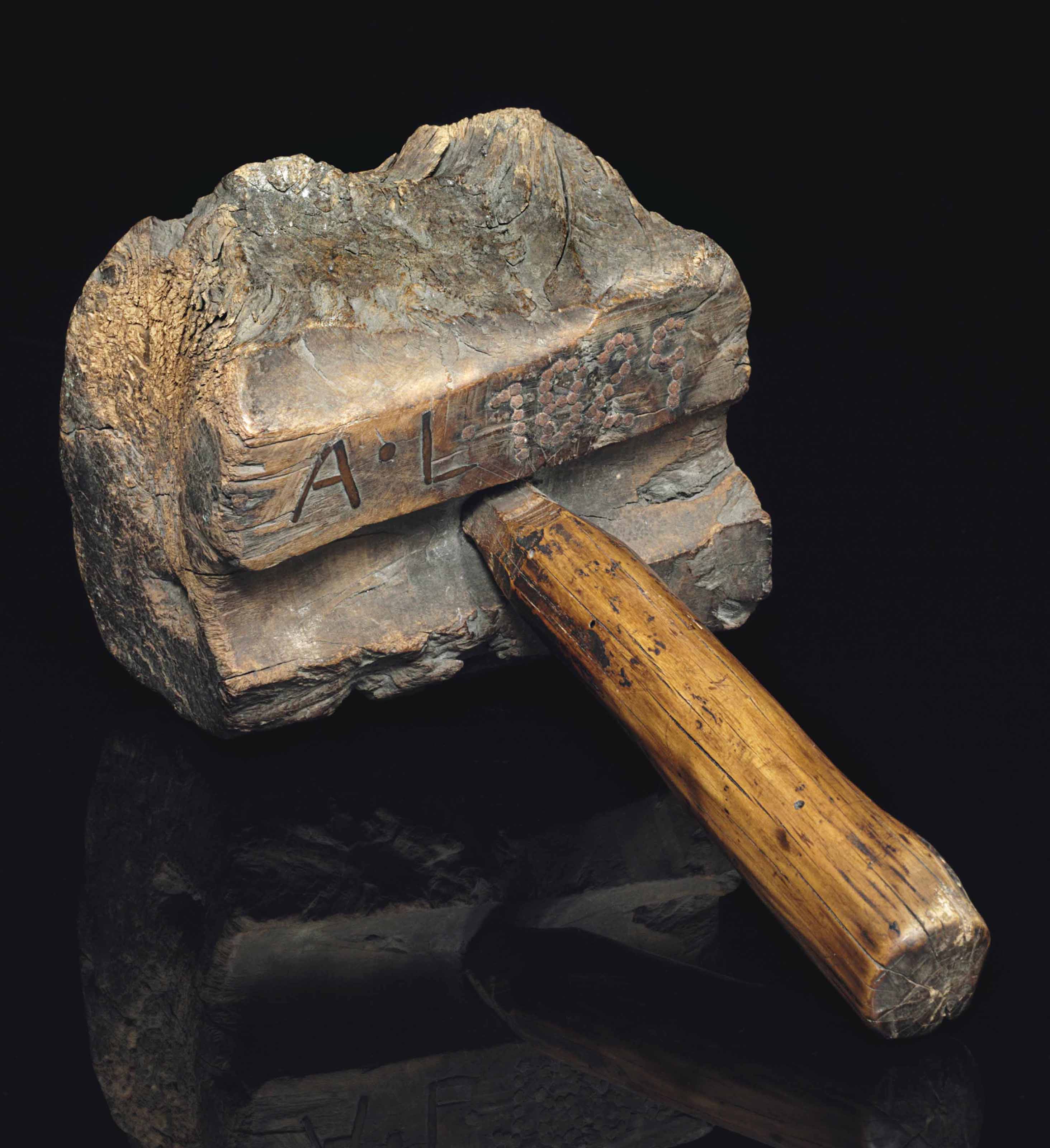 Lincoln, Abraham (1809-1865). A wooden bench mallet, bearing initials (&lsquo;A. L.&rsquo;) horizontally inlayed with iron filings on the underside next to the handle, and (&lsquo;1829&rsquo;) fashioned from iron nails to the right of the initials.&nbsp;Estimate: $300,000-500,000. This lot is offered in Fine Printed Books and Manuscripts Including Americana on 5 December 2017  at Christie&rsquo;s in New York