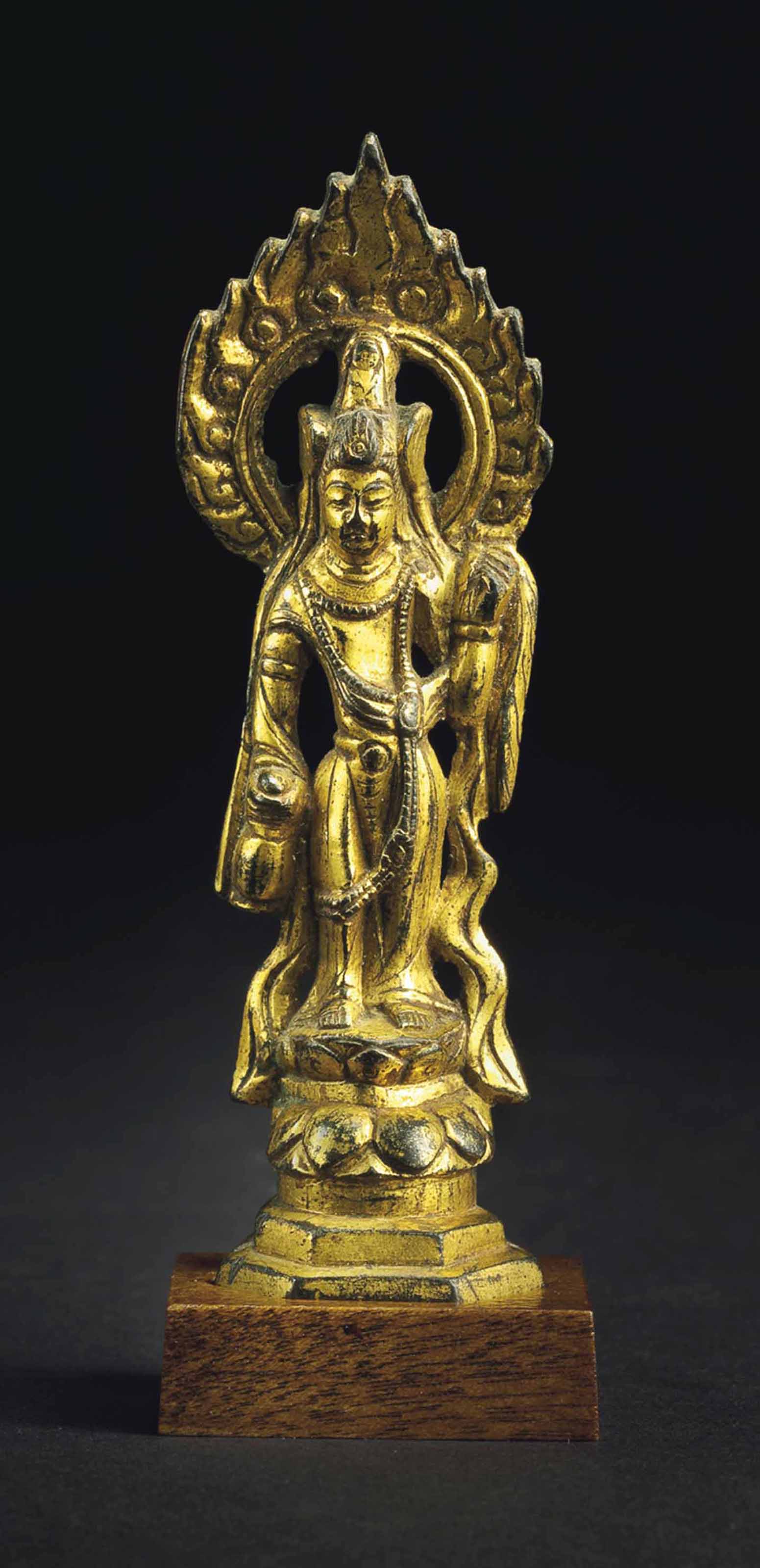 A SMALL GILTBRONZE FIGURE OF A BODHISATTVA