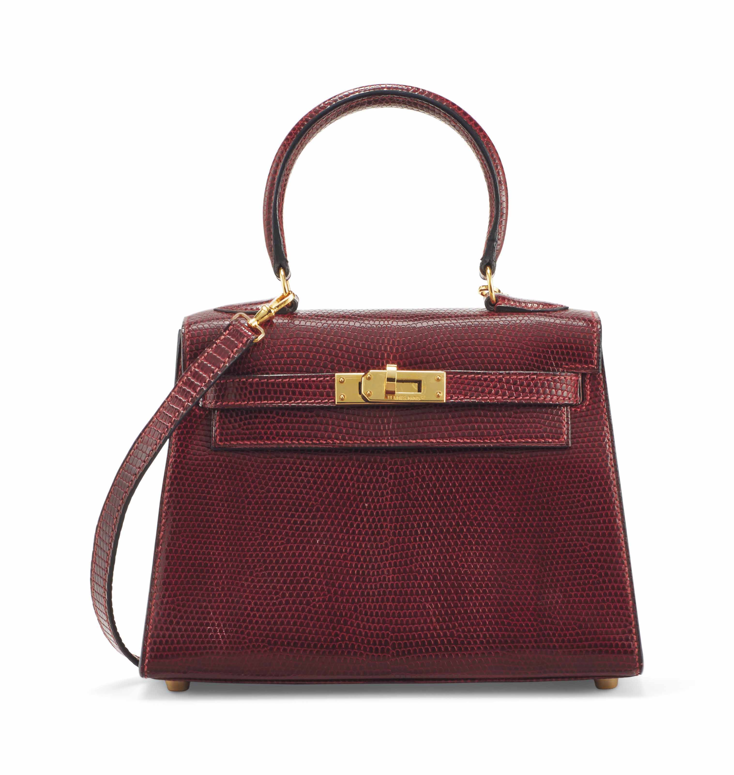 SAC MINI KELLY SELLIER 20 EN LEZARD NILOTICUS LISSE ROUGE H GARNITURE EN METAL DORE auctions price archive