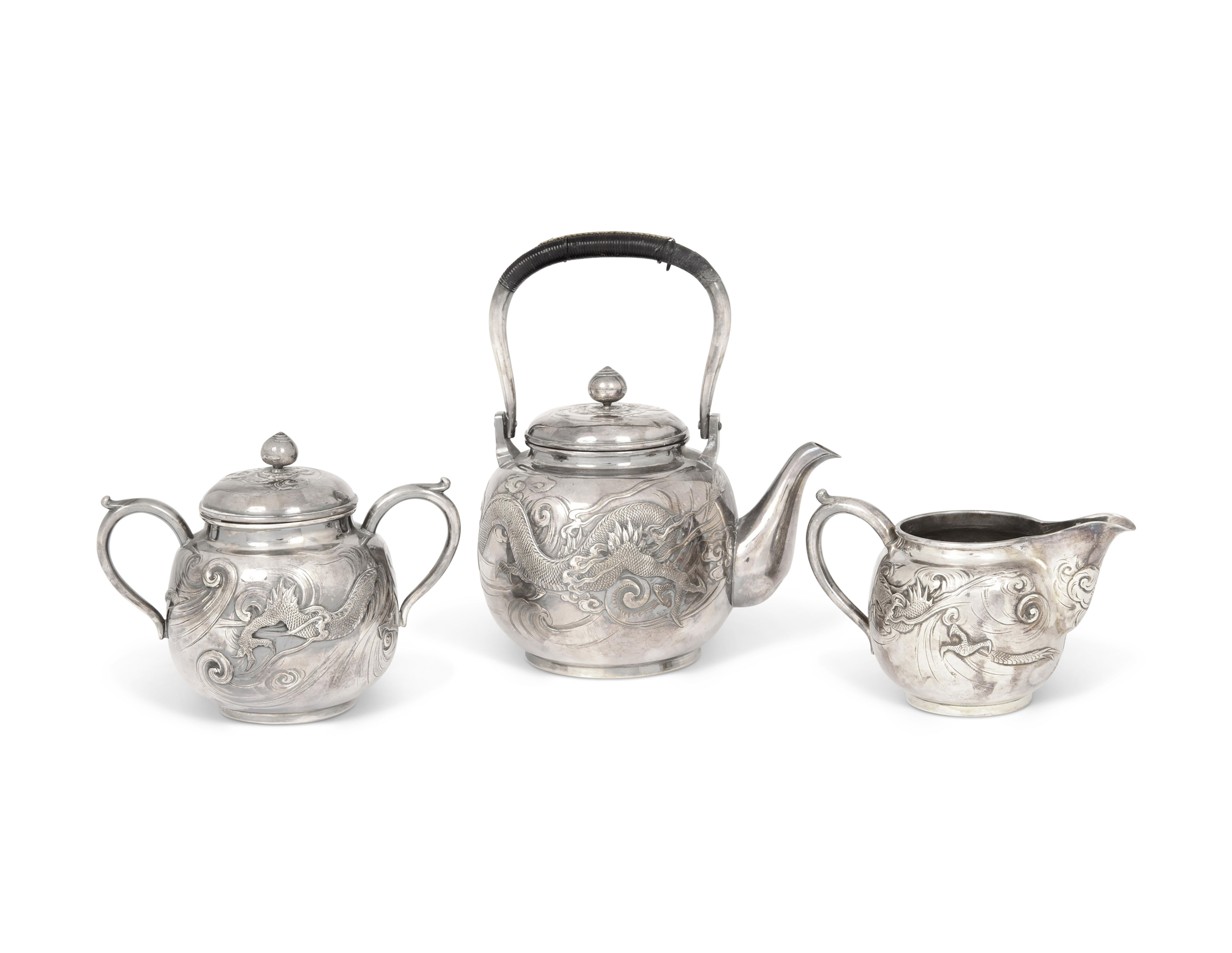 A SILVER TEASET WITH DRAGONS, EACH MARKED GINSEI [MADE OF SILVER