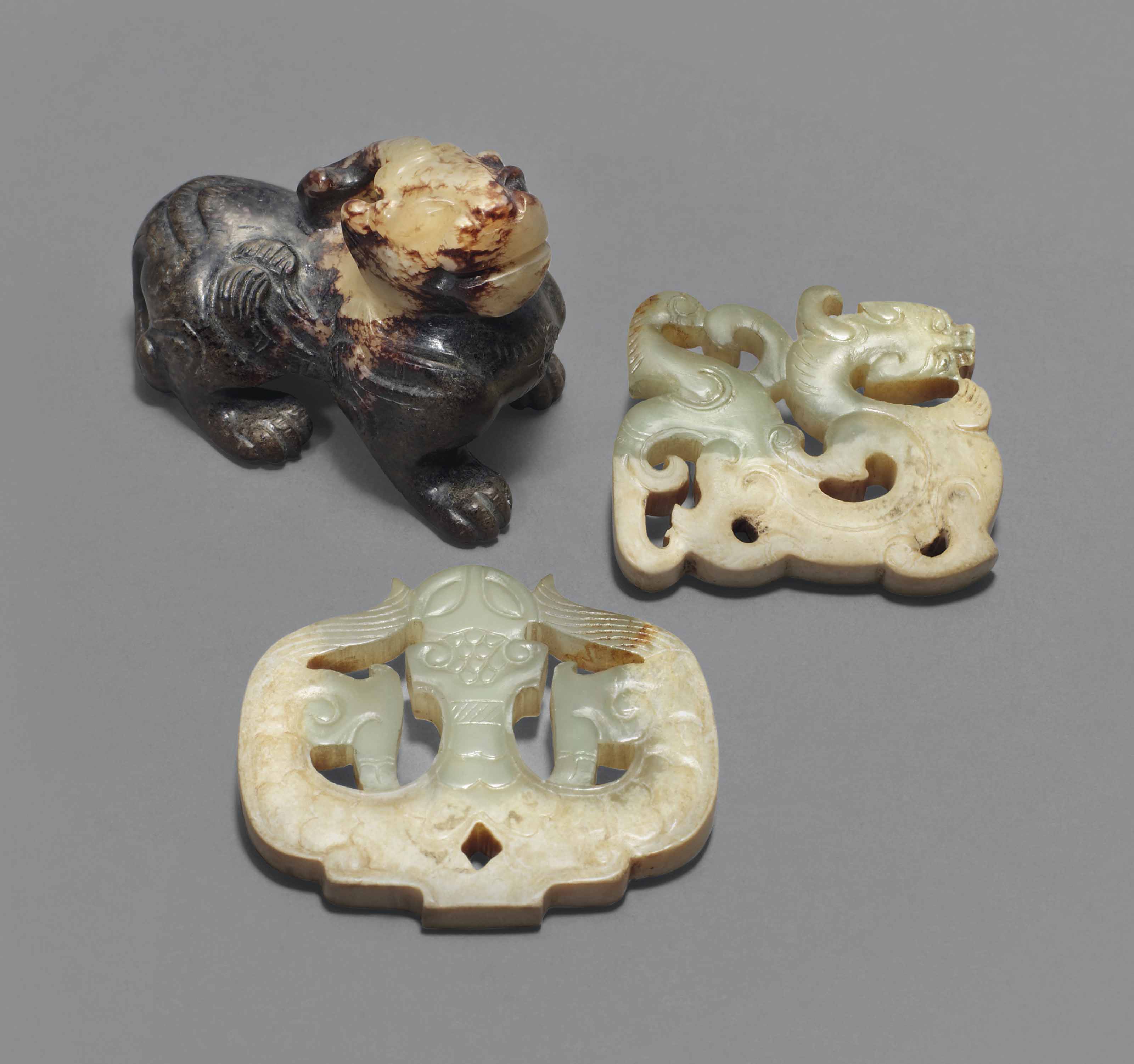 A GROUP OF THREE ARCHAISTIC JADE CARVINGS , MING DYNASTY (13681644) OR