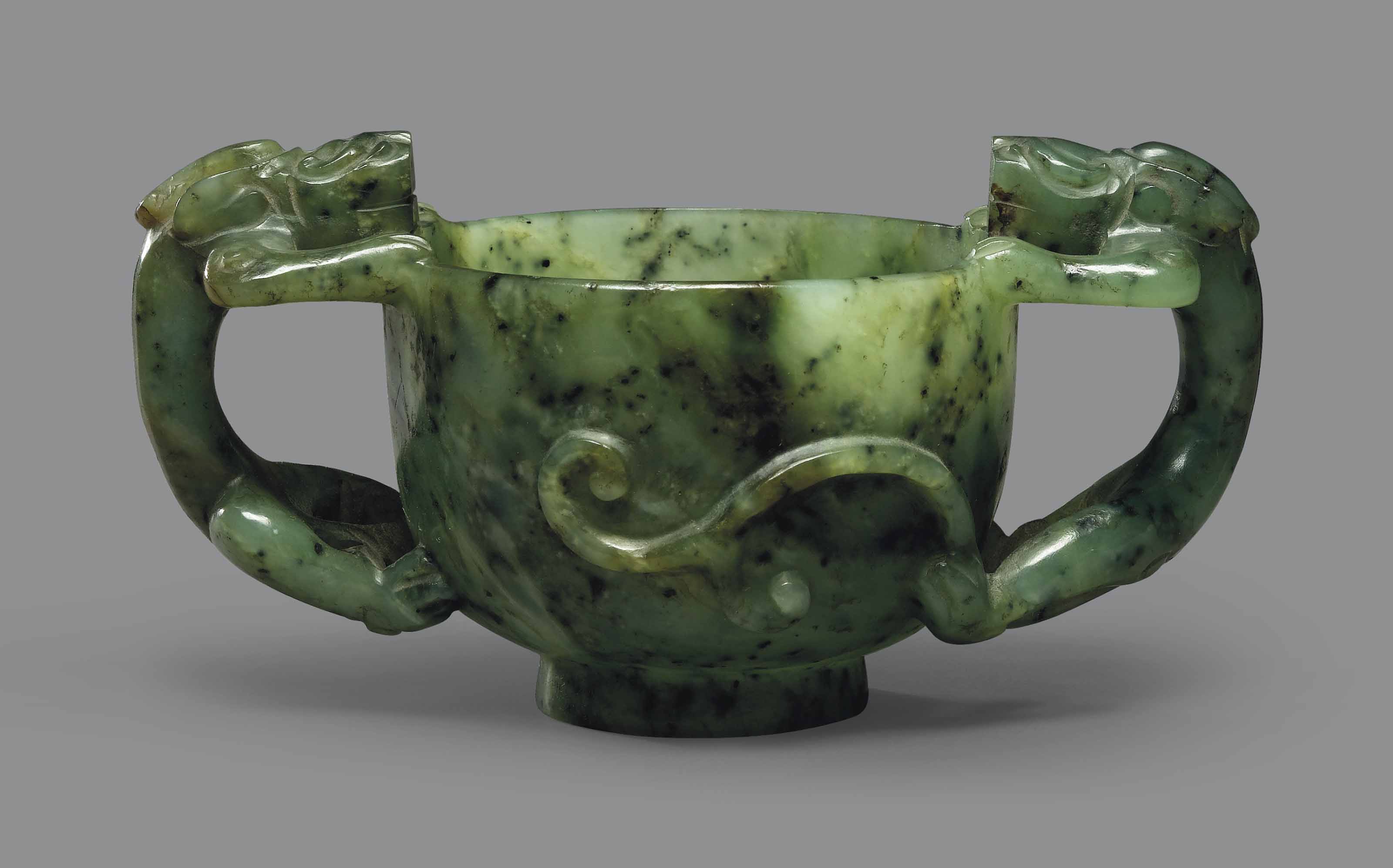 A SPINACHGREEN JADE TWOHANDLED 'CHILONG' CUP , 18TH19TH CENTURY