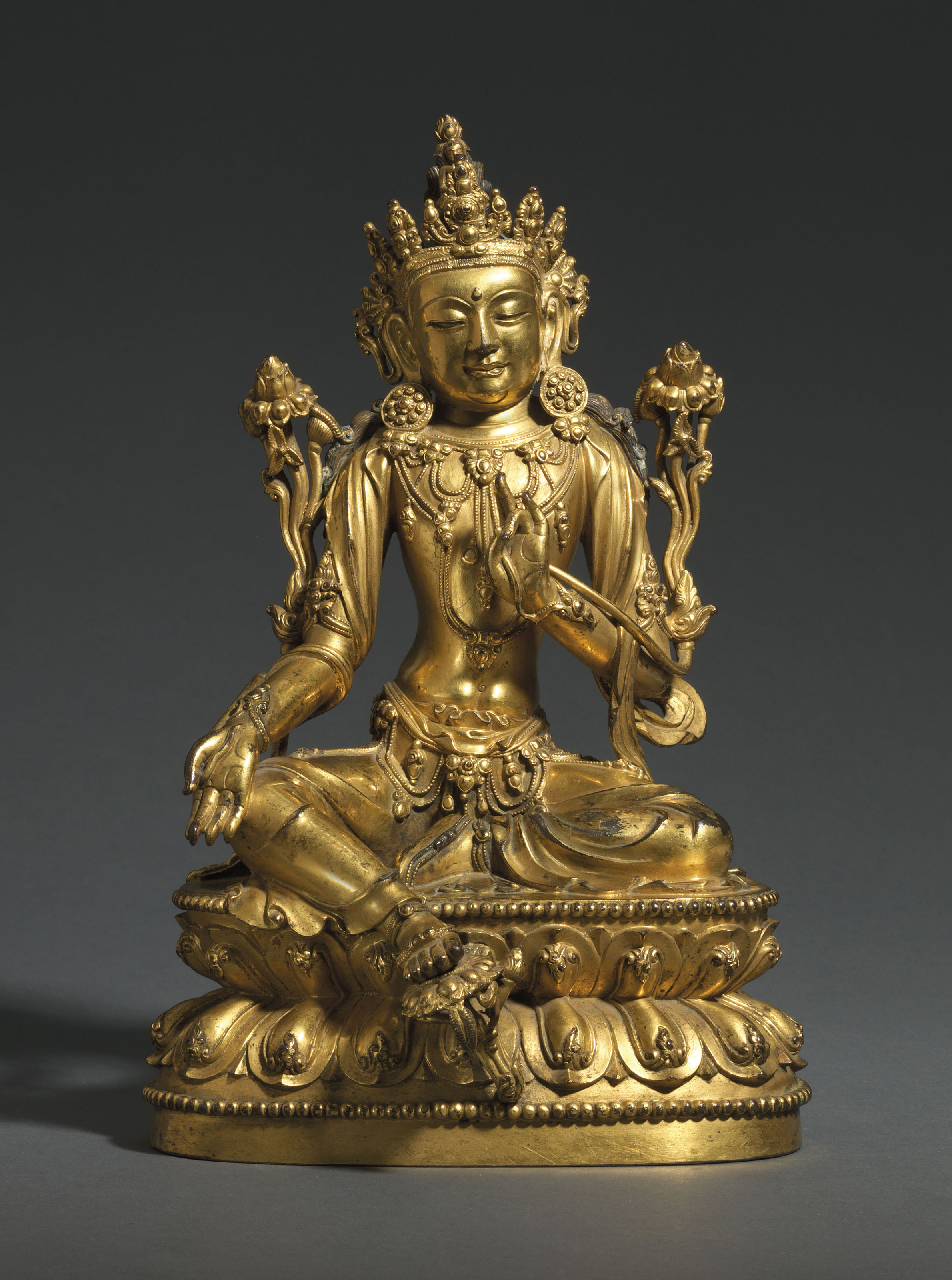 A rare and finely-cast gilt-bronze seated figure of Avalokiteshvara, Xuande six-character incised mark and of the period (1426-1435). 10&frac14;  in (26  cm) high. Sold for £1,928,750 on 6 November 2018 at Christie’s in London