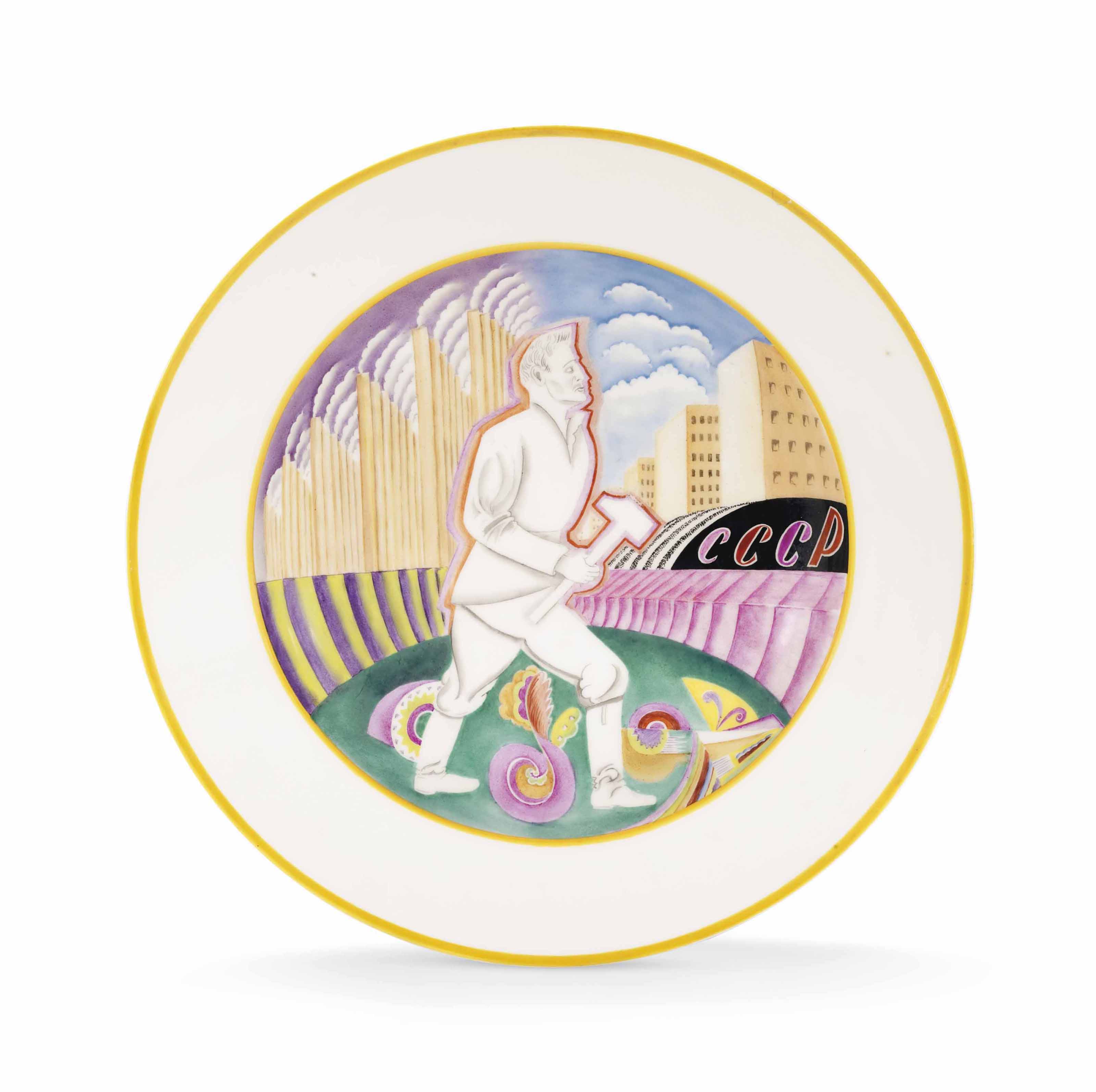 A large and rare Soviet porcelain propaganda platter, by the Imperial Porcelain Factory, St Petersburg, period of Nicholas II, 1906, and the State Porcelain Factory, Petrograd, 1923. After a design by Anton Komashka. 14⅛  in (36  cm) diameter. Sold for &pound;106,250 on 4 June 2018 at Christie&rsquo;s in London