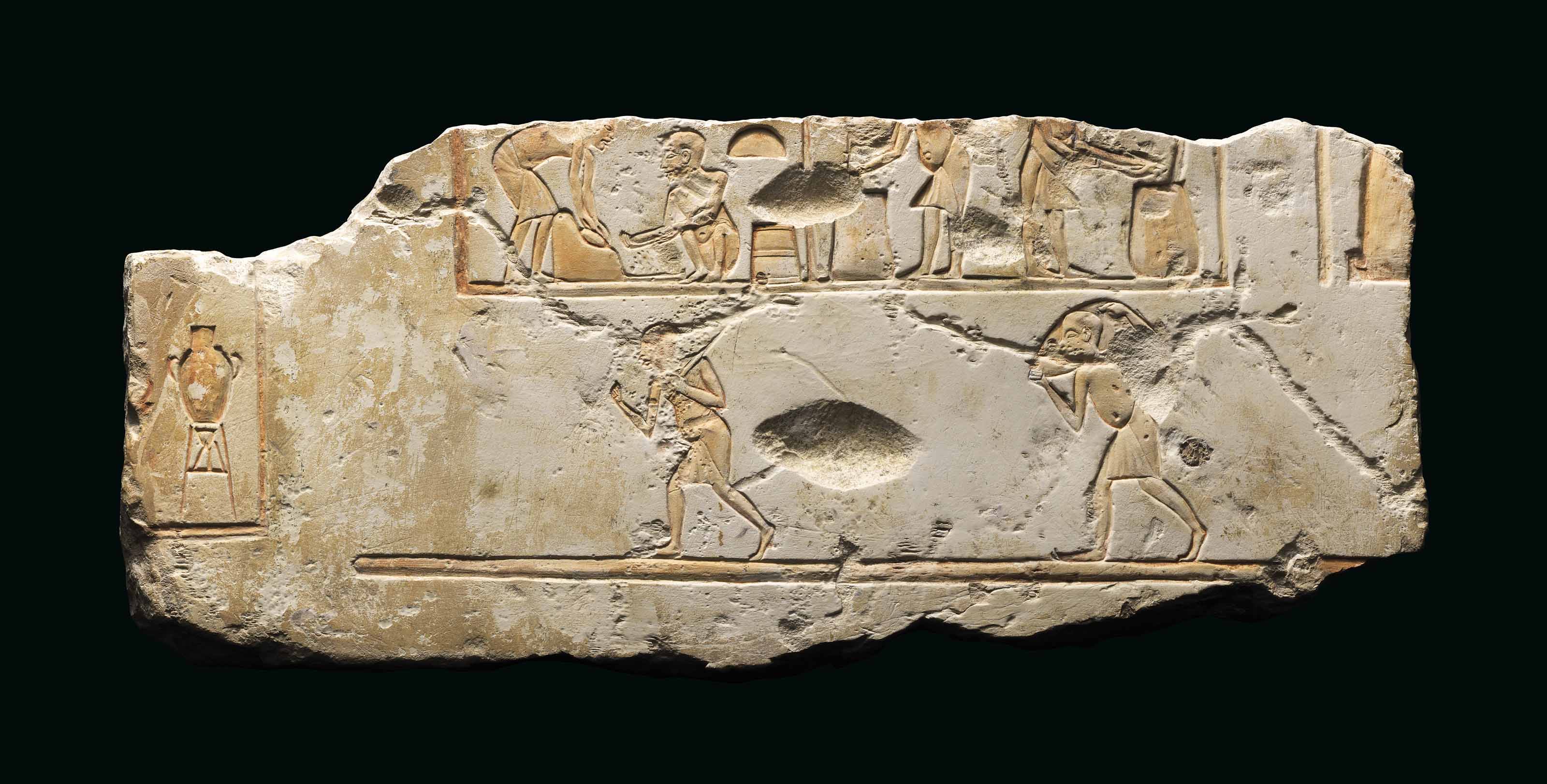 AN EGYPTIAN LIMESTONE RELIEF