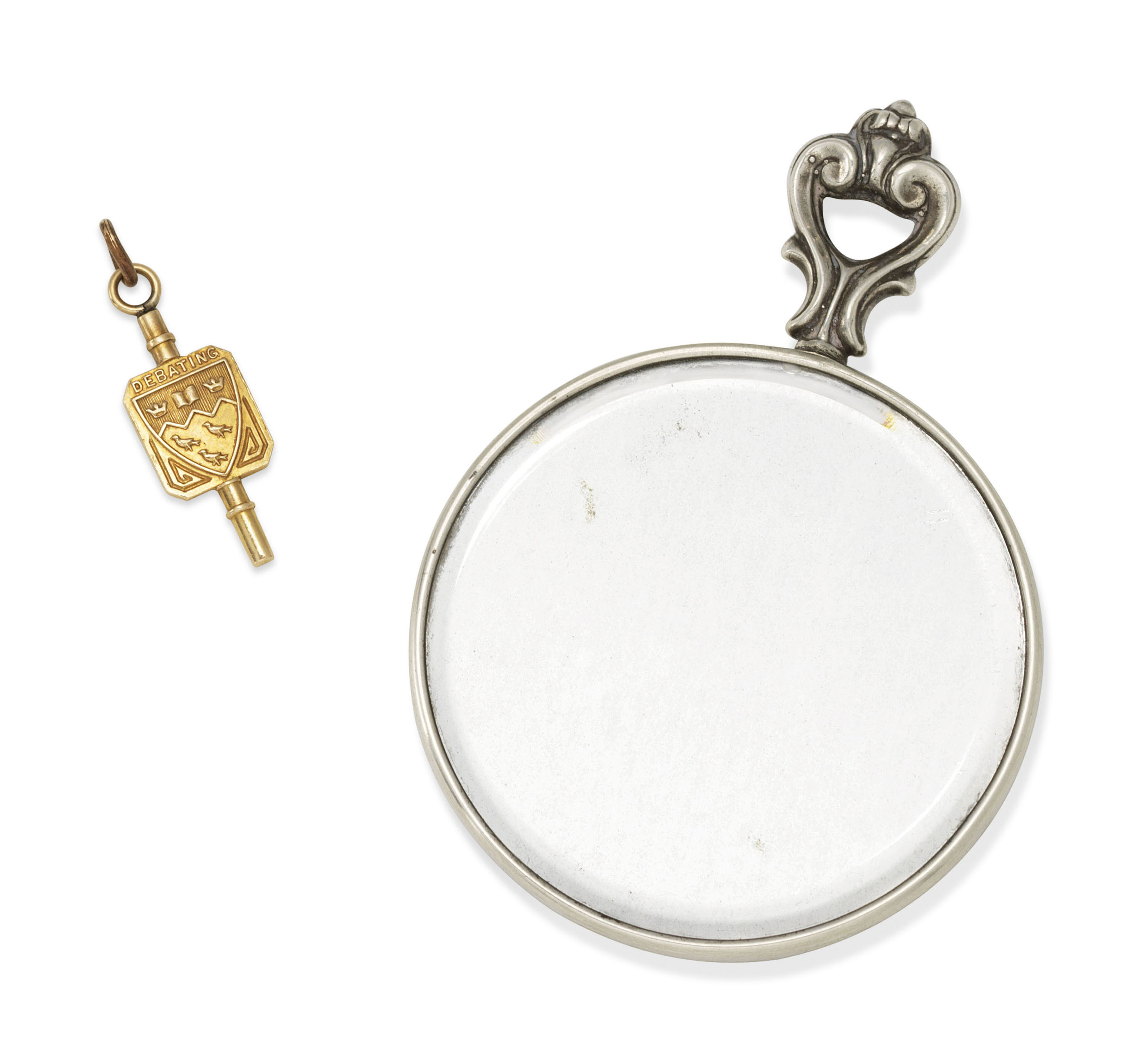A sterling silver pocket mirror by Cartier and a Birks 10k McGill University debating key ring, given by Leonard Cohen to Marianne Ihlen. Provenance: by descent from Marianne  Ihlen. Estimate: &pound;500-700. Offered in Valuable Books and Manuscripts on 11 July 2018 at Christie&rsquo;s in London