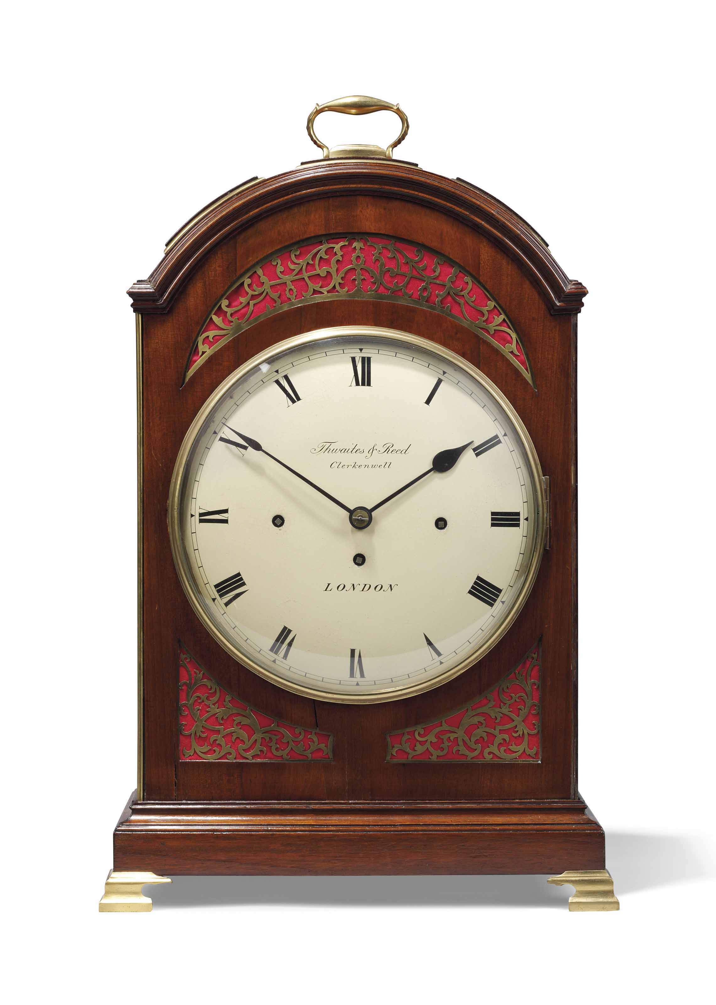 A REGENCY MAHOGANY QUARTERCHIMING TABLE CLOCK