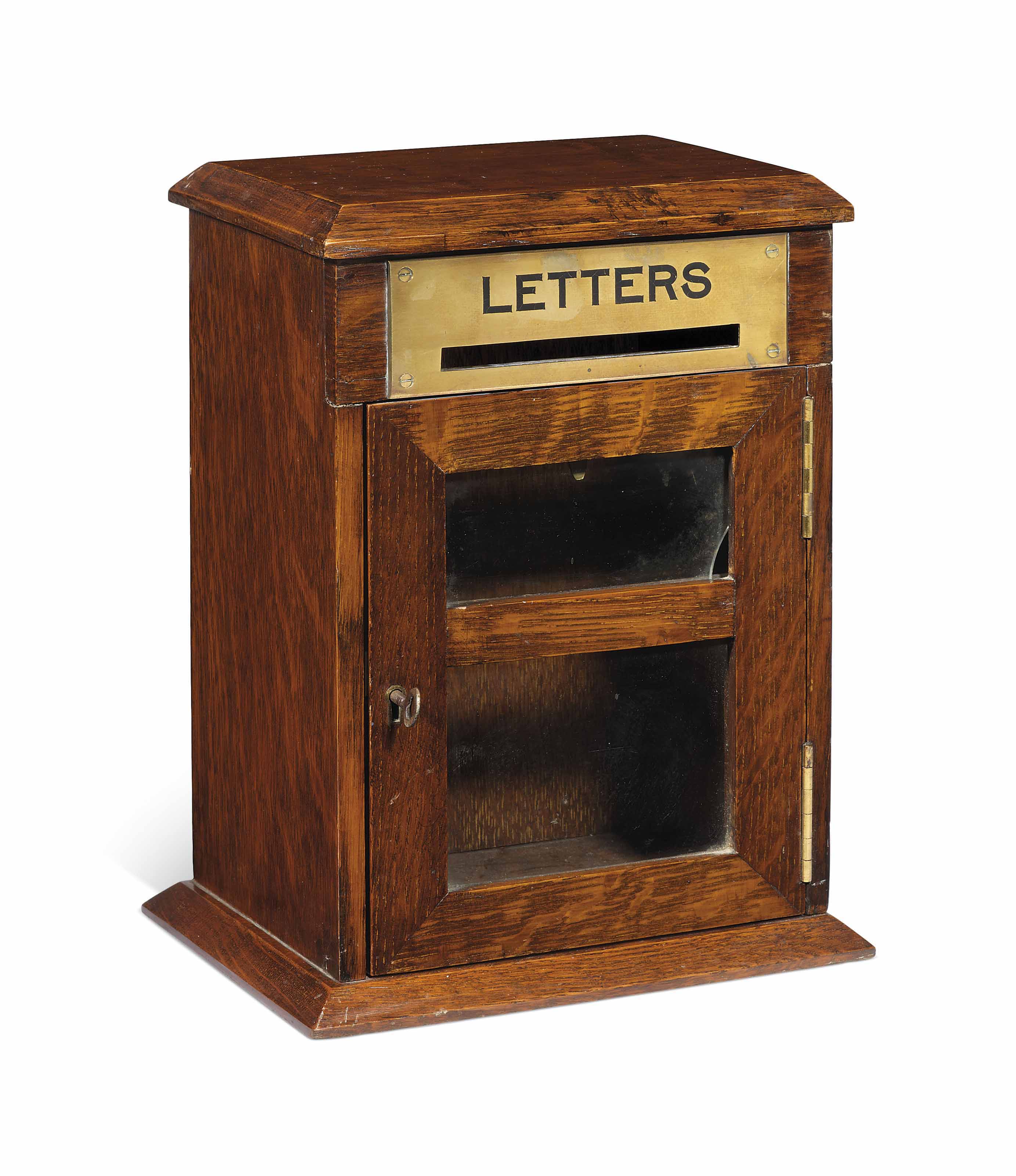 A LATE VICTORIAN OR EDWARDIAN OAK LETTER BOX , CIRCA 1900 Christie's