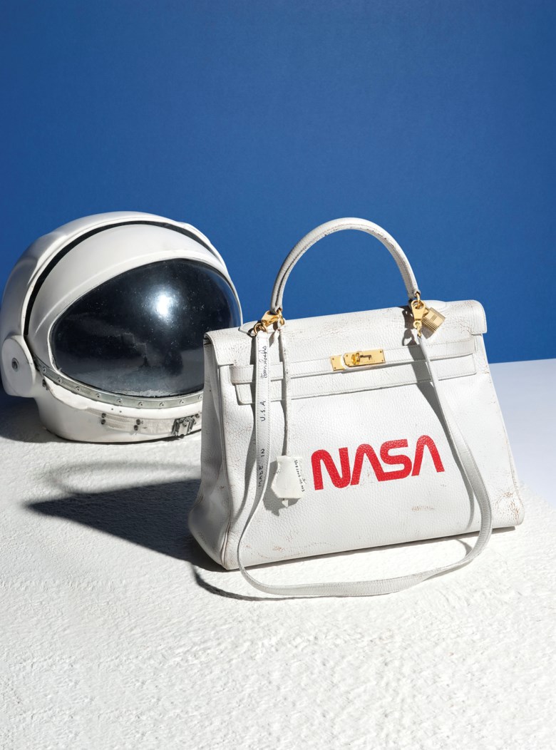 A unique painted white & red Ardennes leather Nasa Retourné Kelly 35 with gold hardware by Tom Sachs, Hermès, 1996, executed in 2009. 35 w x 25 h x 13 d cm. Sold for £40,000 on 12 June 2018 at Christie’s in London