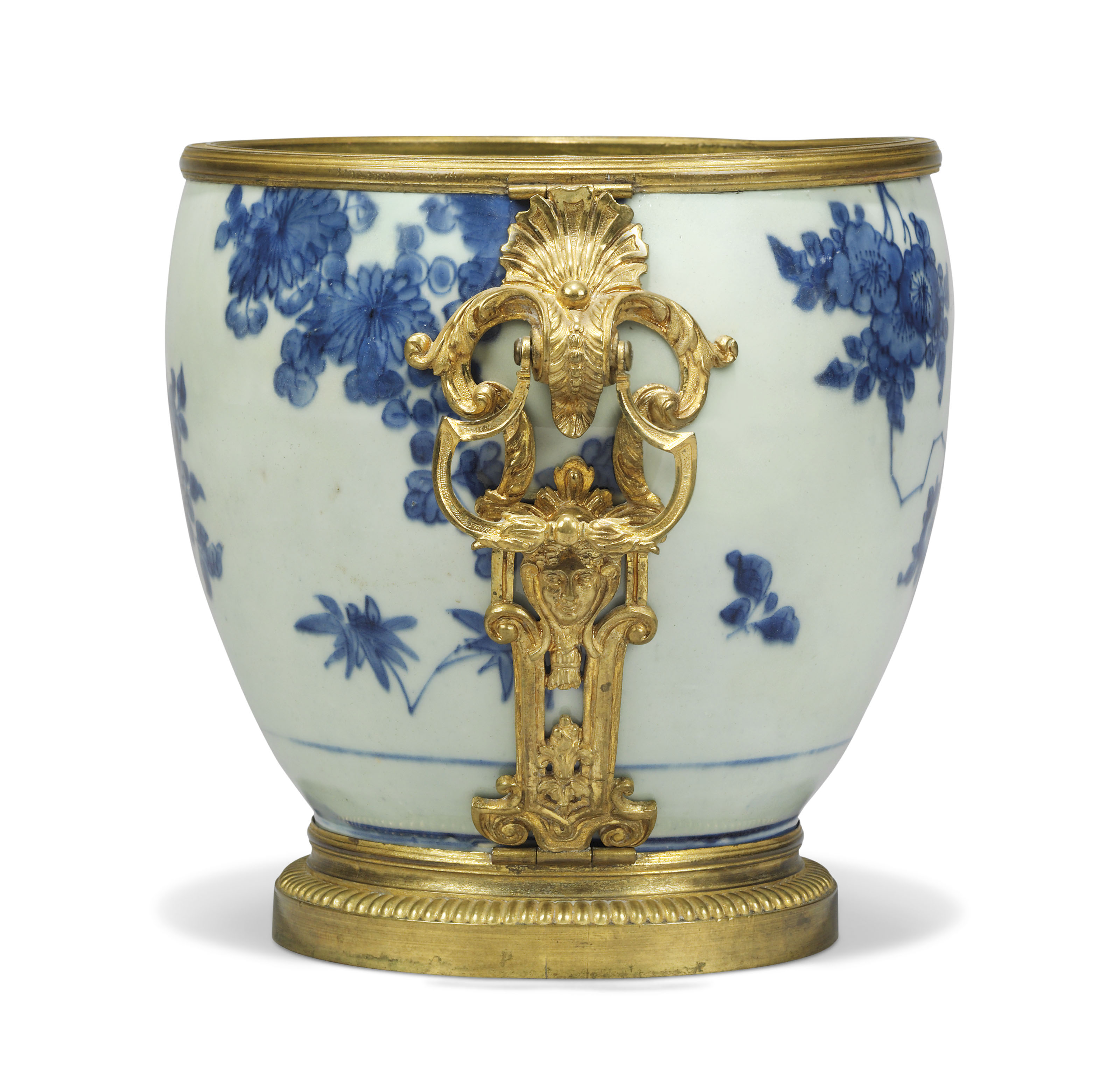 A REGENCE ORMOLUMOUNTED CHINESE BLUE AND WHITE PORCELAIN CACHEPOT