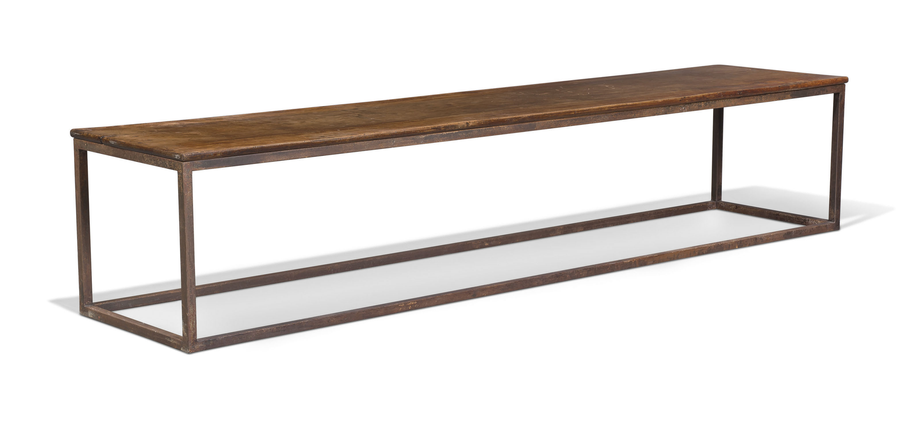 A Walnut And Cast Iron Long Low Table
