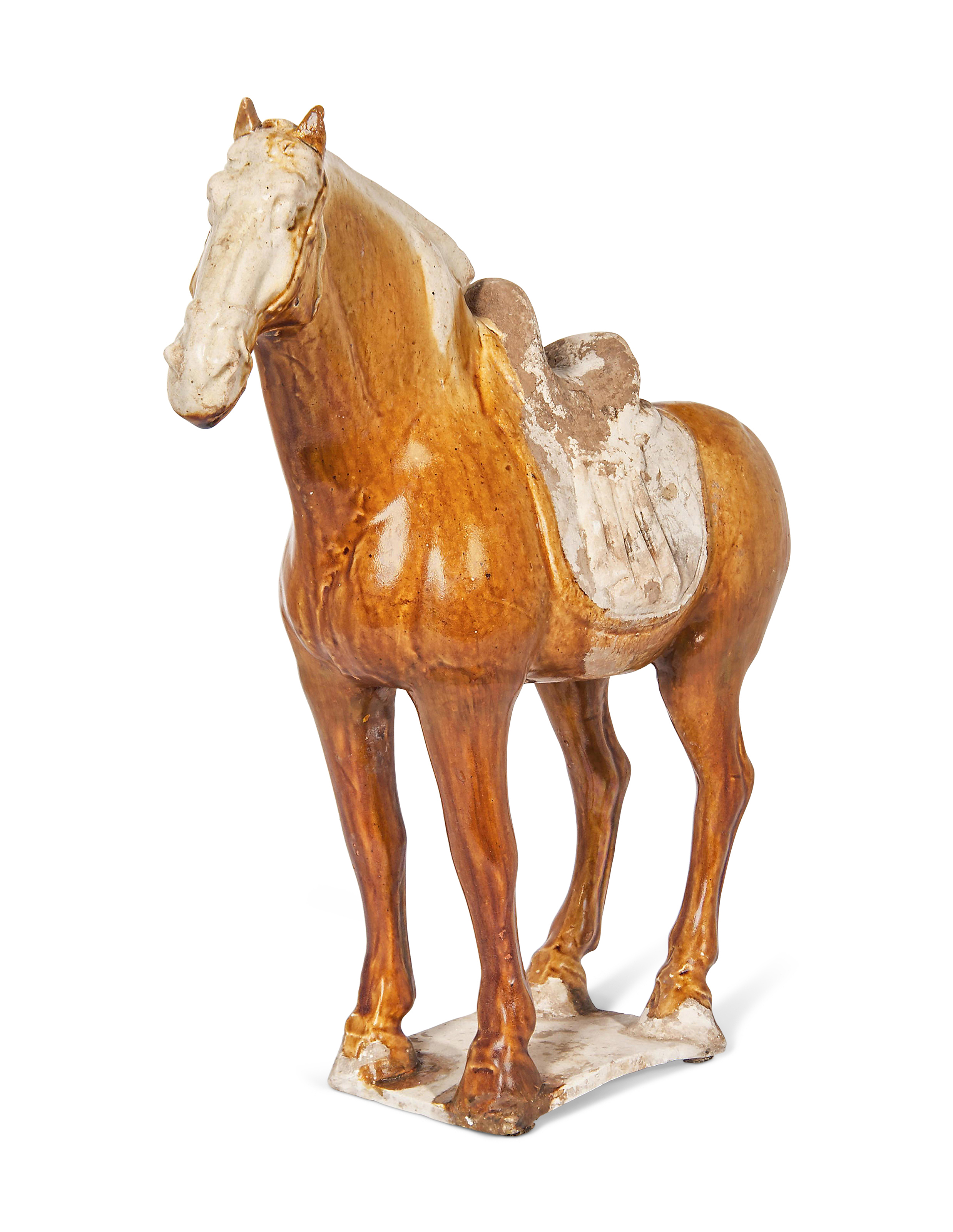 AN AMBER AND CREAM-GLAZED MODEL OF A HORSE, TANG DYNASTY (618-907 AD 