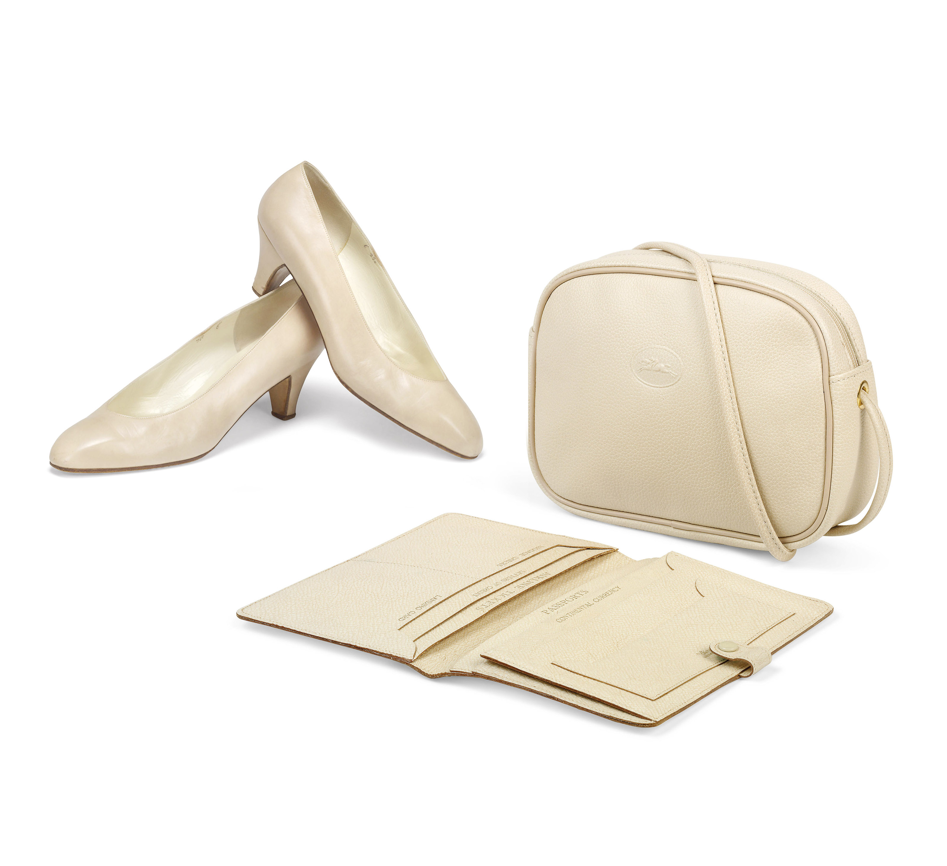 A CREAM STAMPED LEATHER SHOULDER BAG AND A TRAVEL WALLET TOGETHER WITH