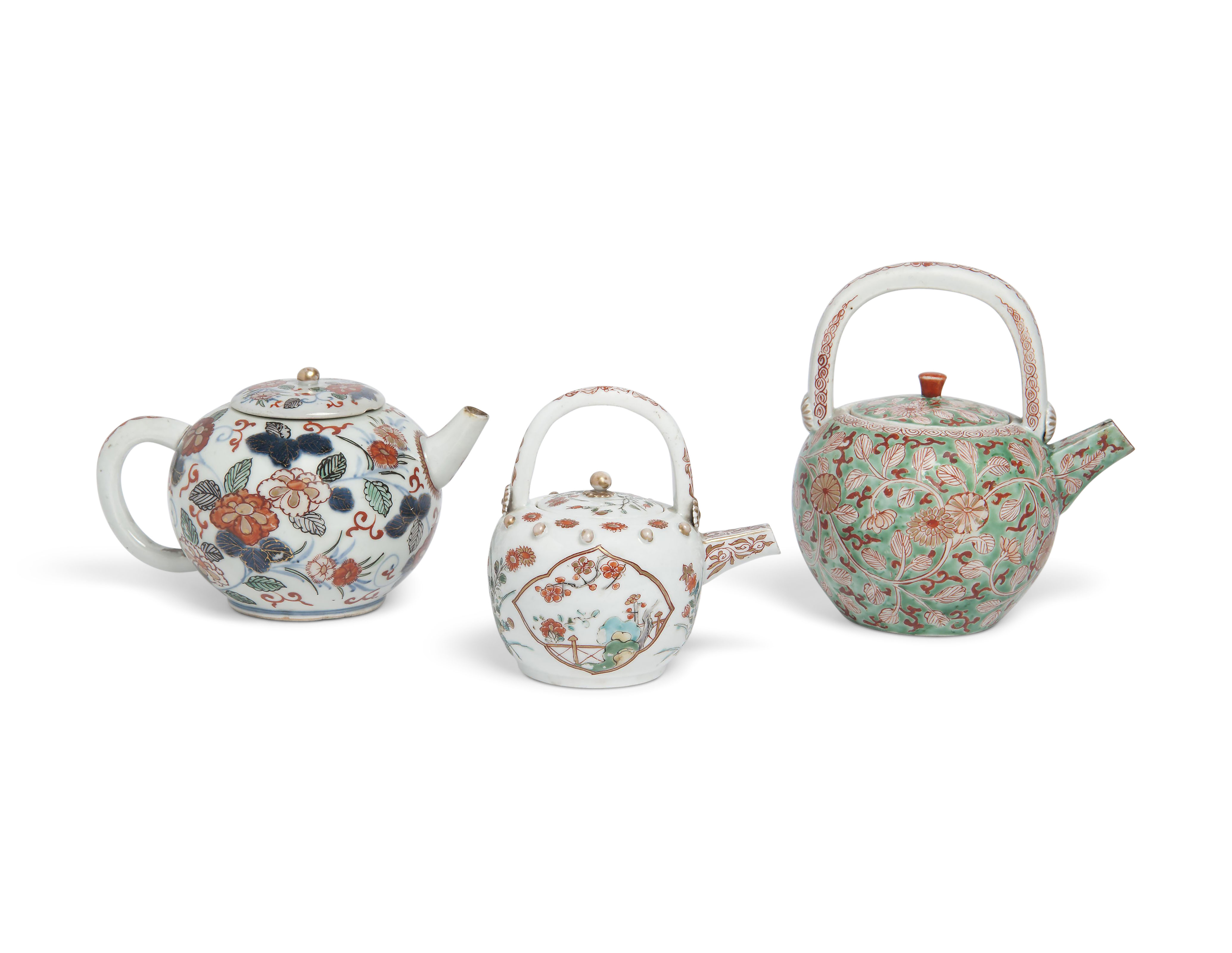 TWO JAPANESE IMARI TEAPOTS AND COVERS AND AN ARITA TEAPOT AND COVER