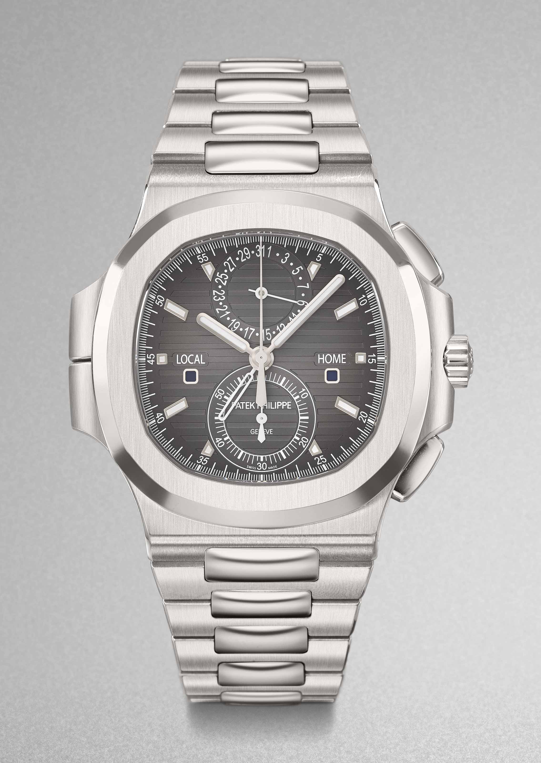Patek Philippe A Very Fine Stainless Steel Automatic Chronograph Dual Time Wristwatch With Bracelet Date Original Certificate And Box Signed Patek Philippe Geneve Ref 5990 1a 001 Nautilus Model Movement No 6 028 692 Case