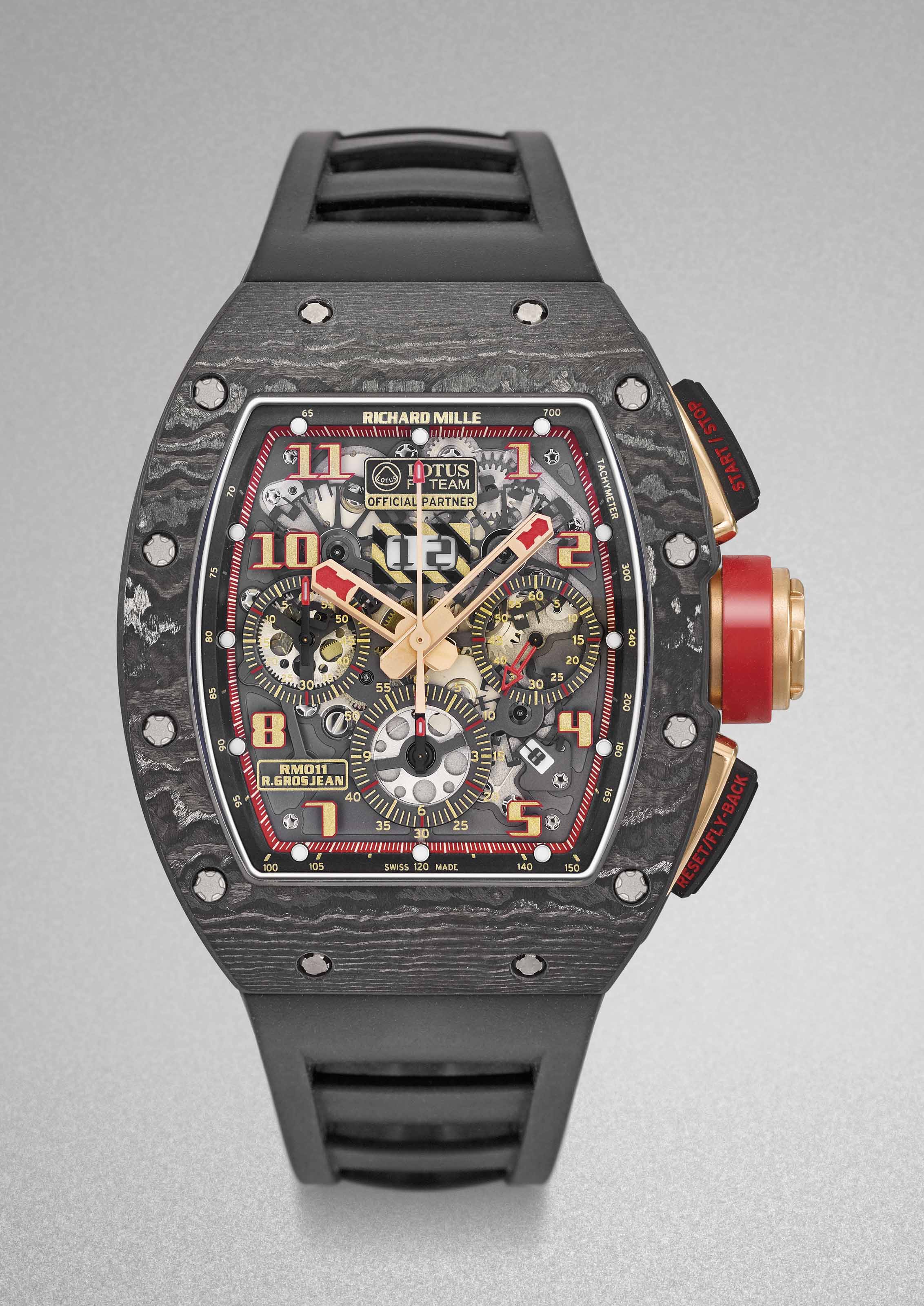 Richard Mille A Rare And Impressive Ntpt And Gold Limited Edition Automatic Semi Skeletonized Fly Back Chronograph Wristwatch With Date Original Warranty And Box Signed Richard Mille Rm011 R Grosjean Lotus F1 Team