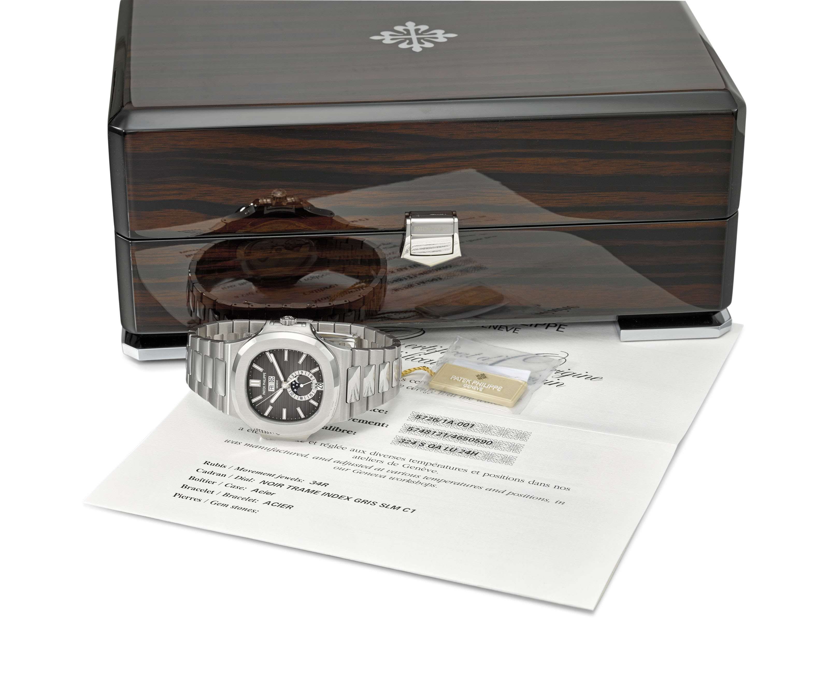 Patek Philippe A Very Fine And Rare Stainless Steel Automatic Annual Calendar Wristwatch With Sweep Centre Seconds Moon Phases 24 Hour Indication Original Certificate And Box Signed Patek Philippe Geneve Nautilus