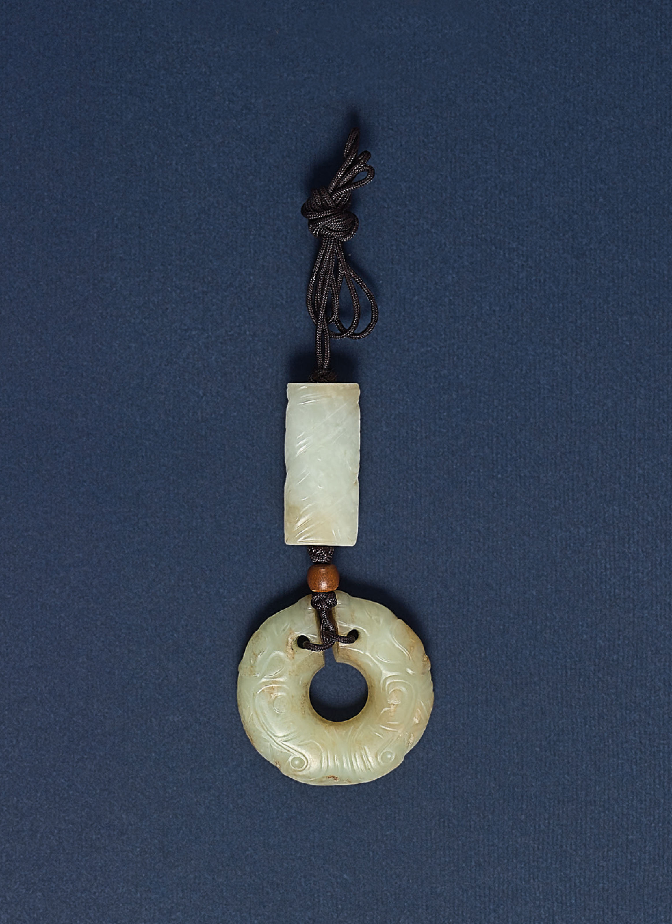 TWO JADE 'DRAGON' PENDANTS , SHANG DYNASTY (16001100 BC) OR LATER