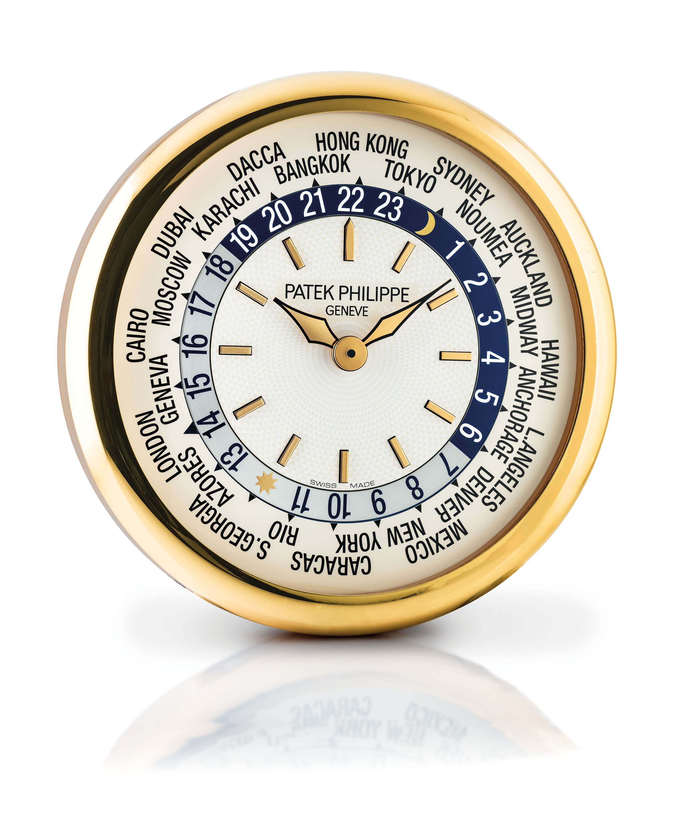 PATEK PHILIPPE. A BRASS WORLD TIME WALL CLOCK