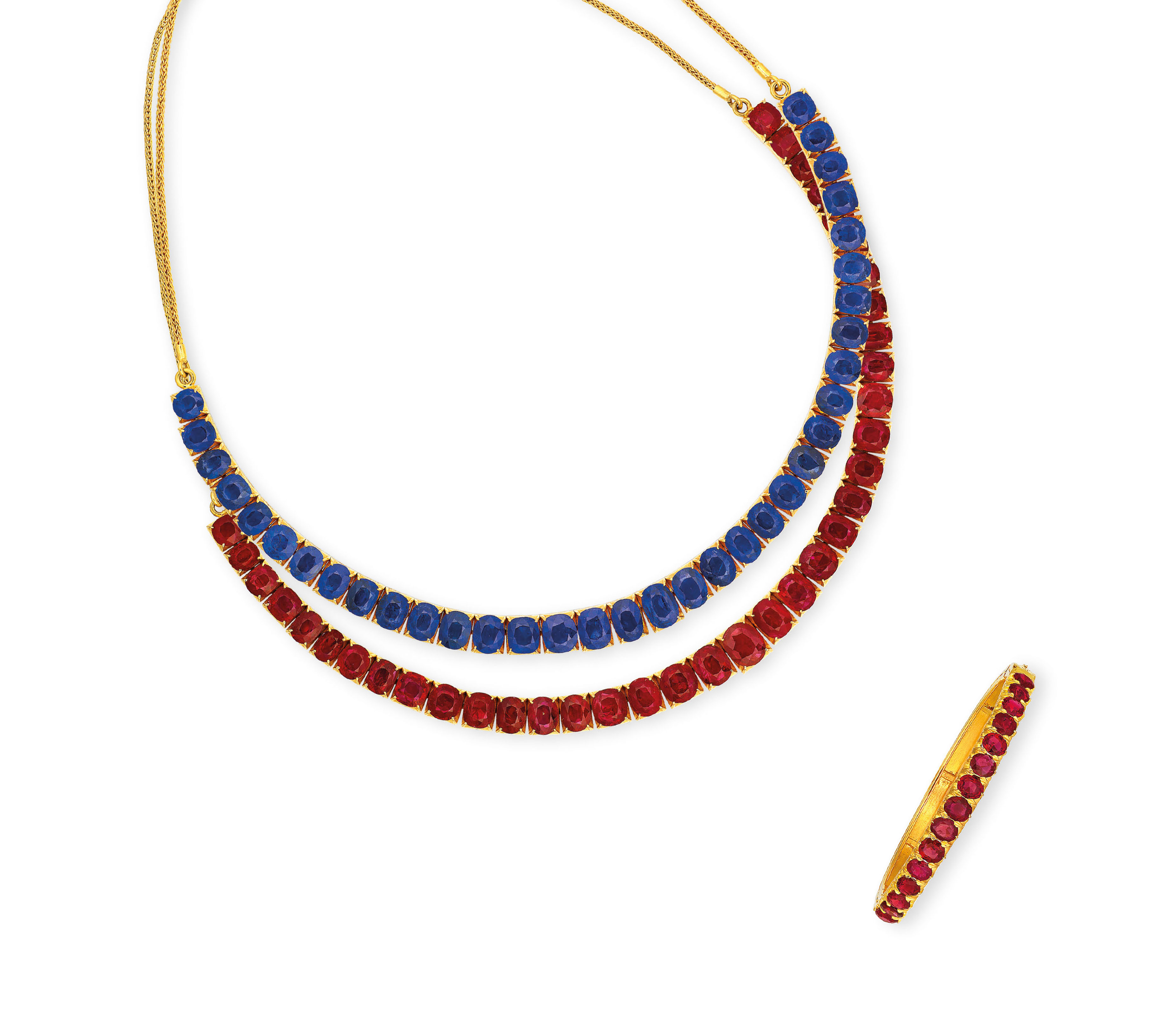 TWO RUBY AND SAPPHIRE NECKLACES, AND RUBY BANGLE Christie's