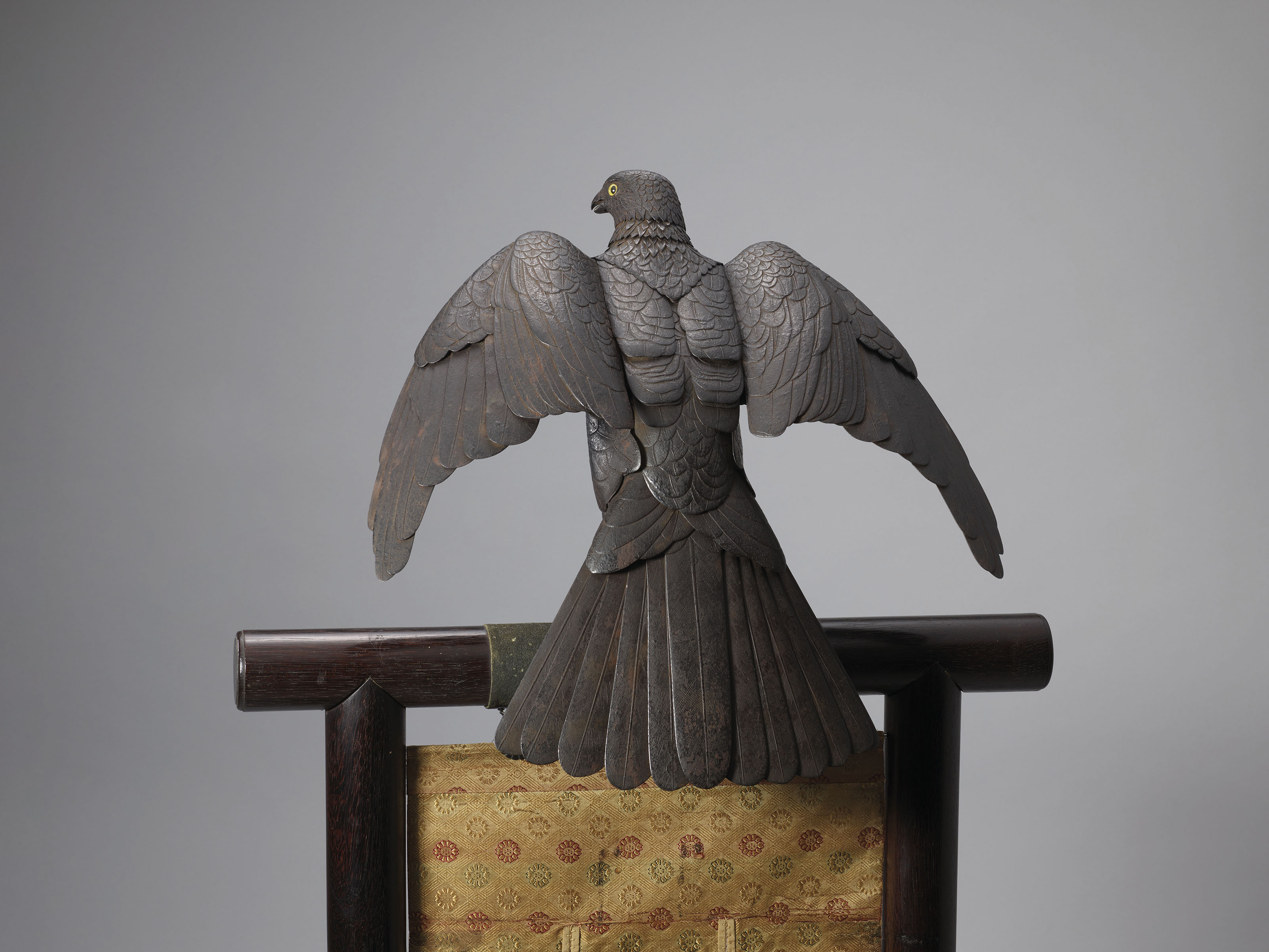 An important iron articulated sculpture of an eagle on stand