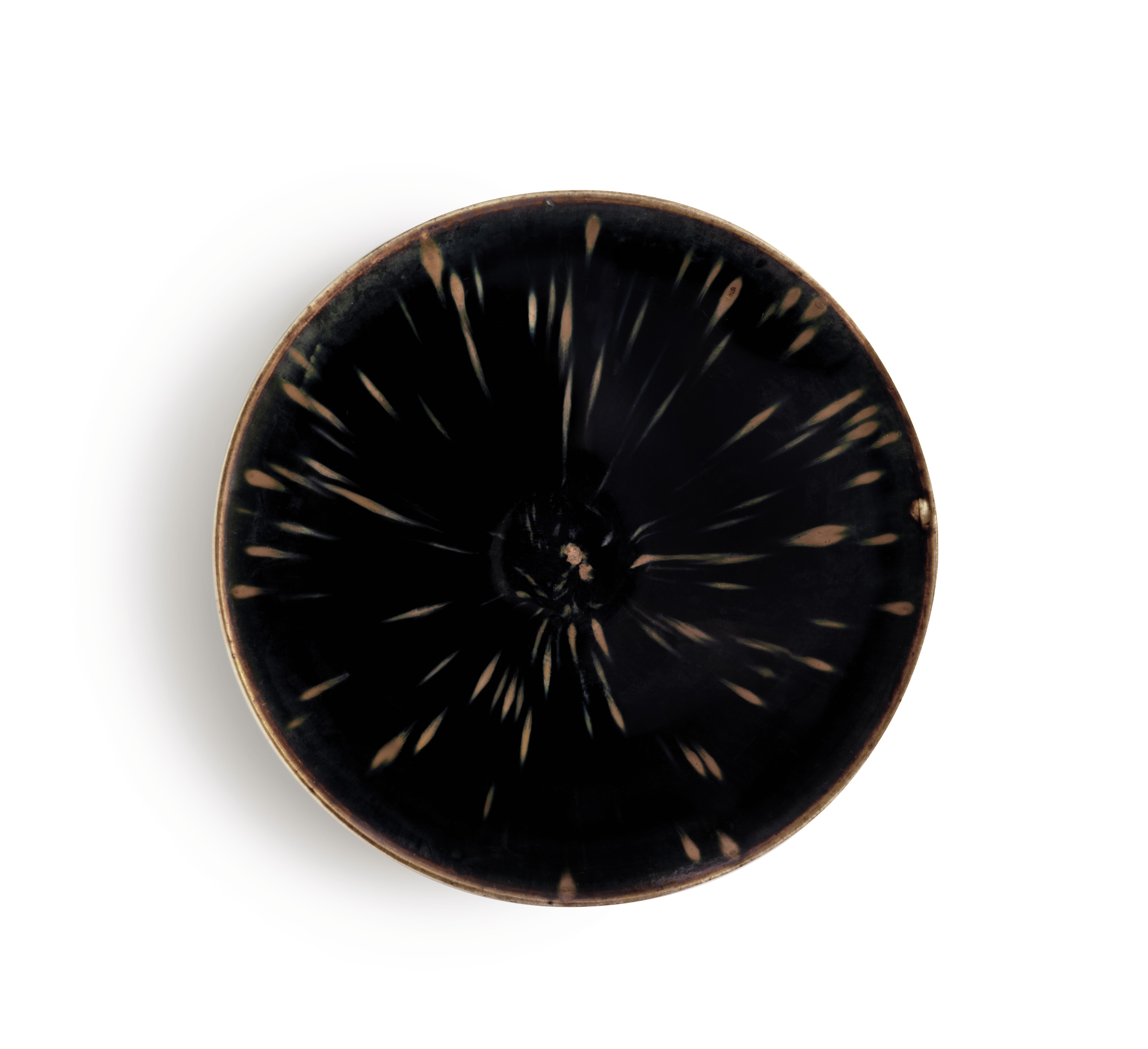 A highly important ding russet-splashed black-glazed conical bowl, Northern Song dynasty (960-1127). 7&frac12;  in (19  cm)  diam, Japanese double wood box. Sold for: $4,212,500 on 22 March 2018 at Christie&rsquo;s in New York