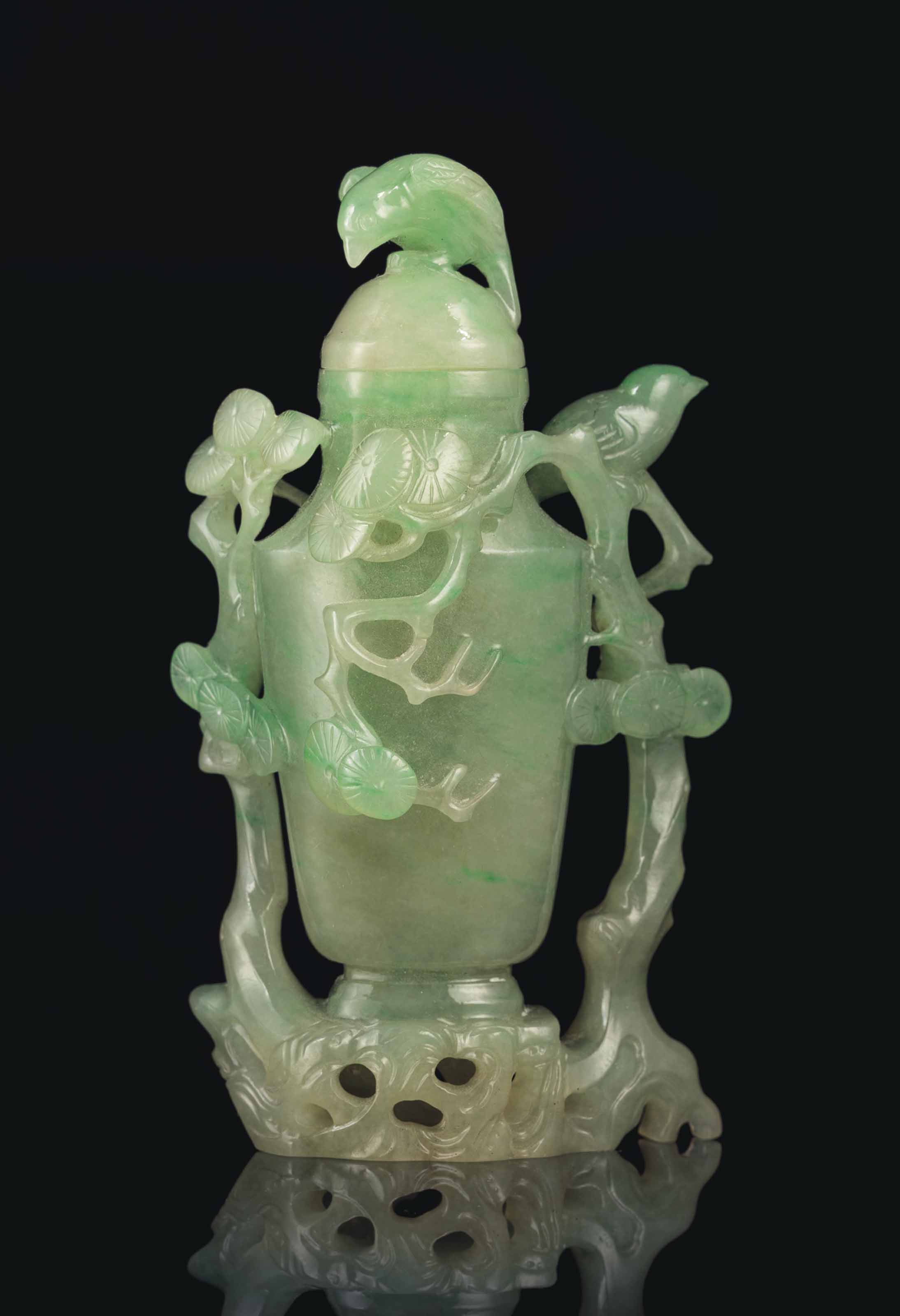 A PALE GREEN JADEITE VASE AND COVER Christie's