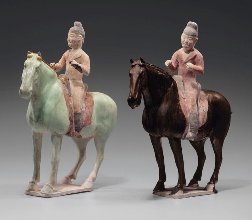 TWO RARE GLAZED AND PAINTED POTTERY FIGURES OF EQUESTRIANS, TANG