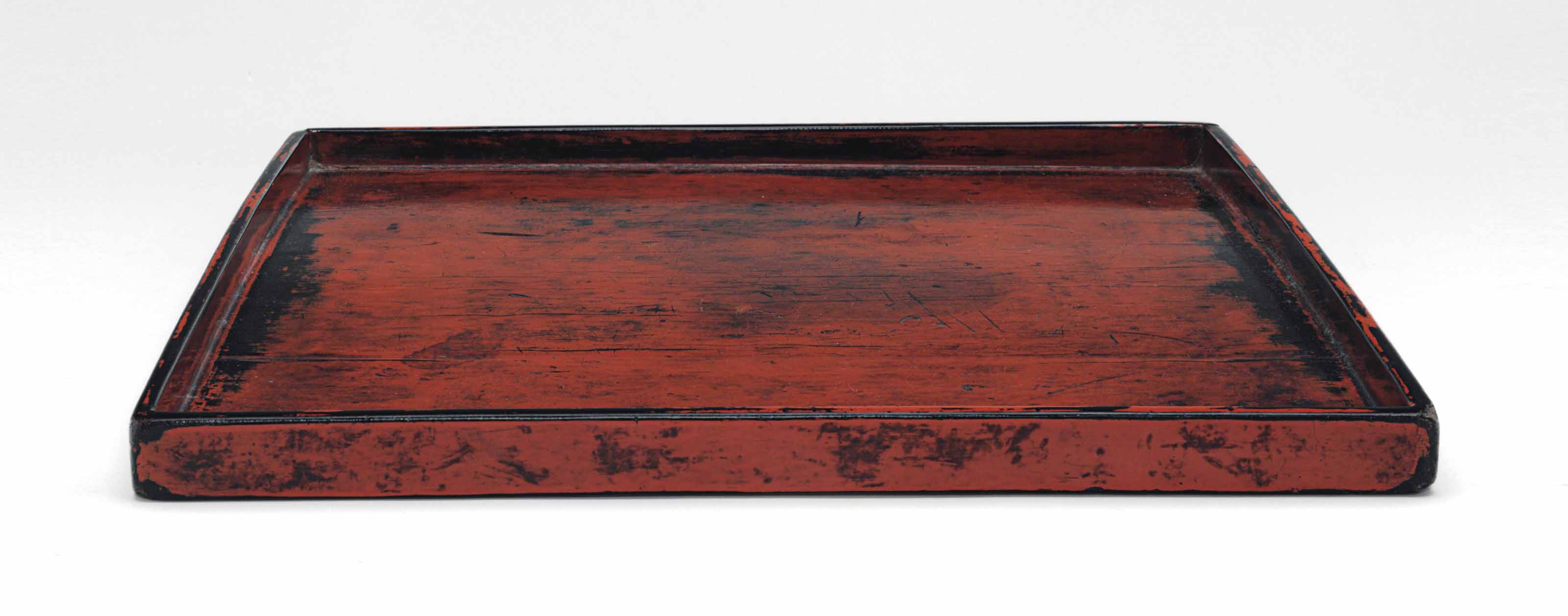 A BLACK AND RED LACQUERED WOOD SQUARE TRAY, NEGORO WARE, MOMOYAMA