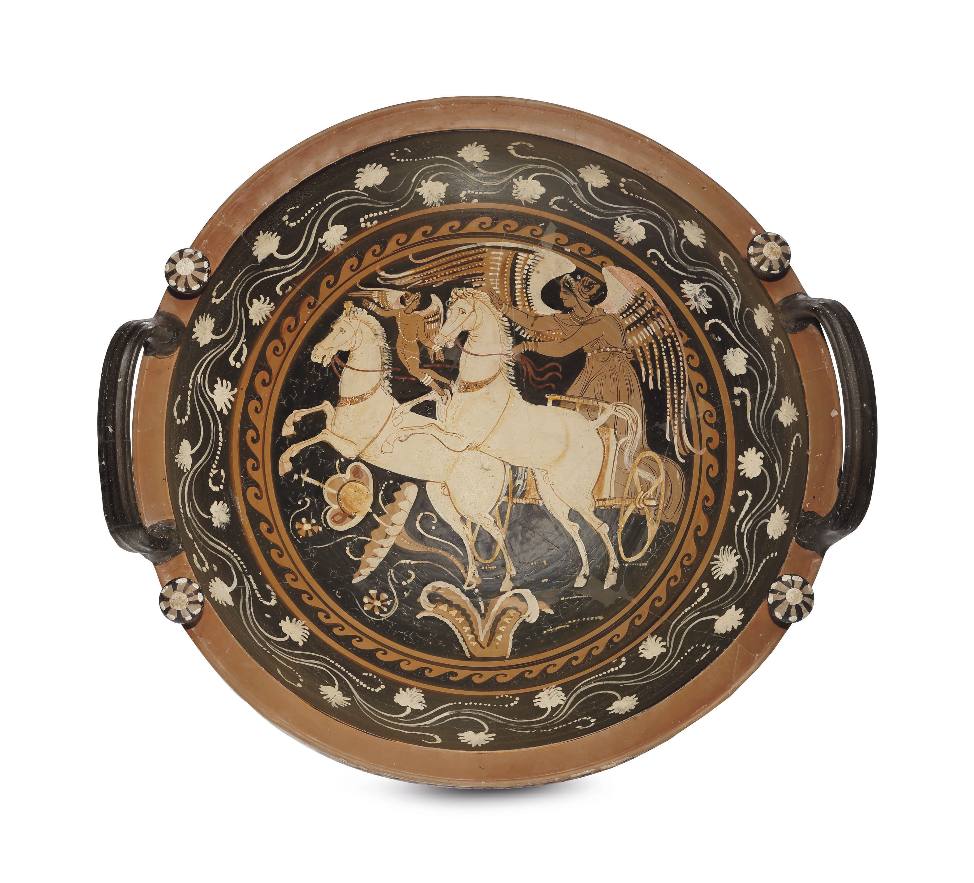 AN APULIAN REDFIGURED KNOBHANDLED PATERA , ATTRIBUTED TO THE