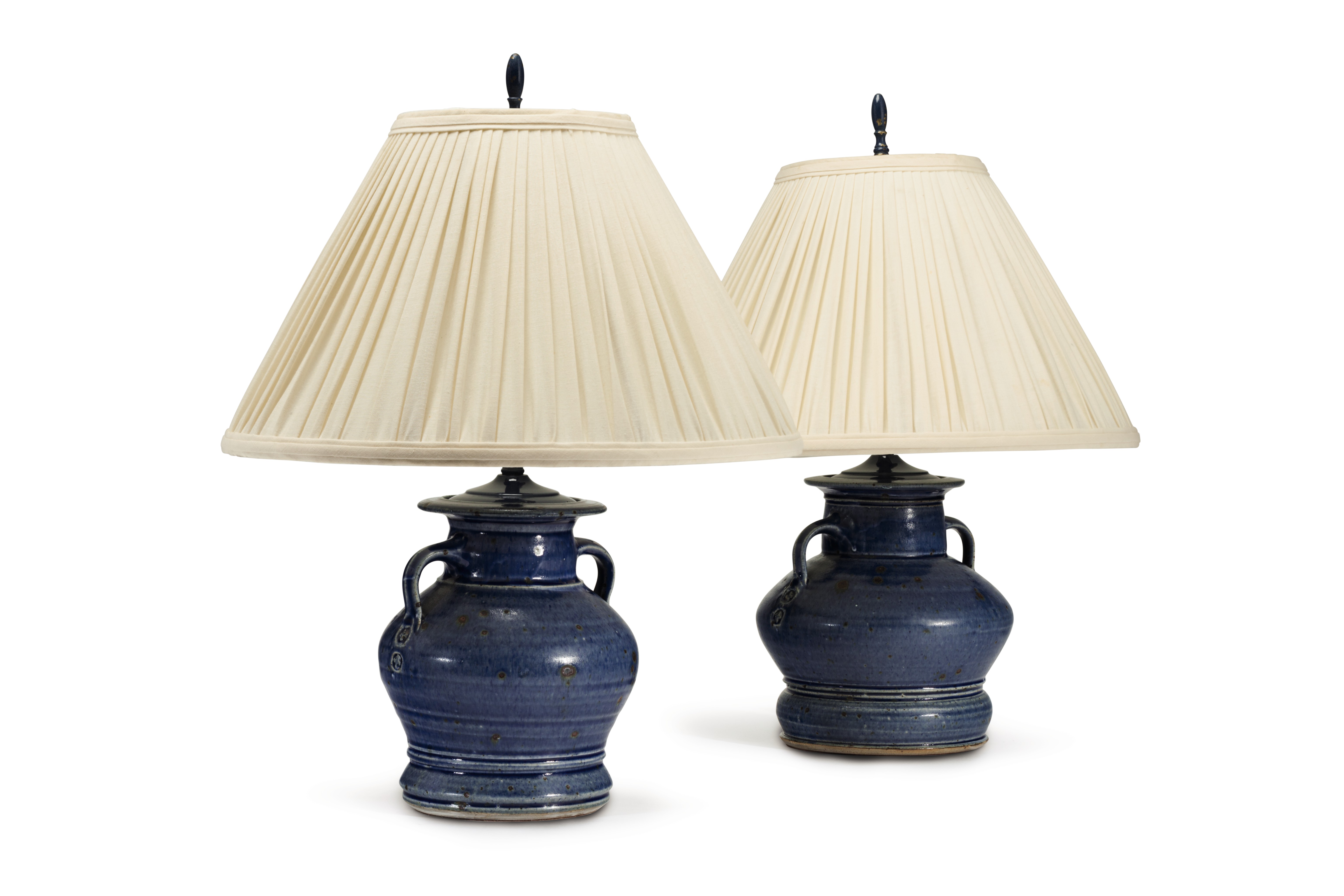 A PAIR OF BLUE-GLAZED STONEWARE TWO-HANDLED JARS, MOUNTED AS LAMPS