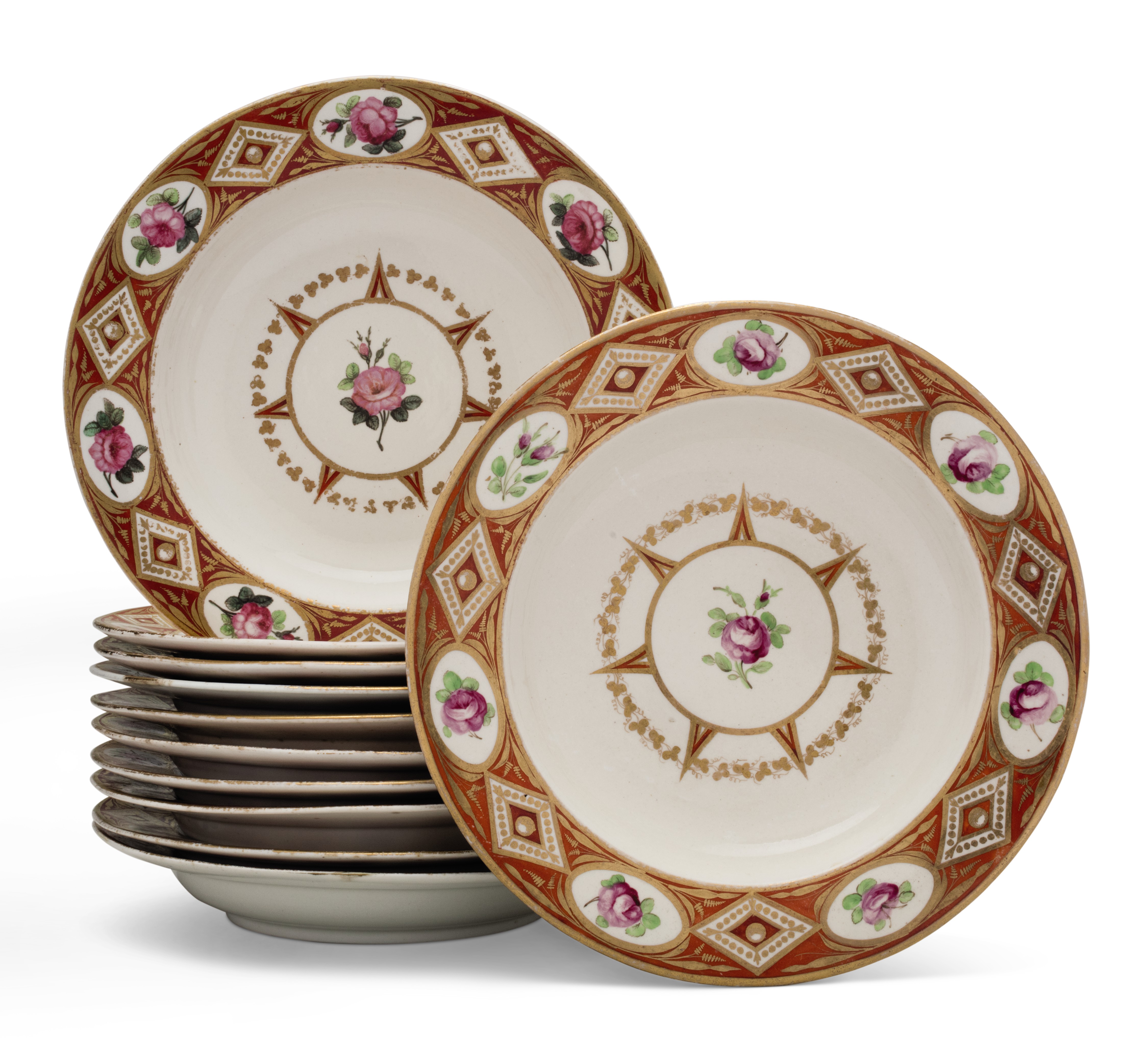 ELEVEN DERBY PORCELAIN IRONRED GROUND SOUP PLATES, CIRCA 1800, PUCE