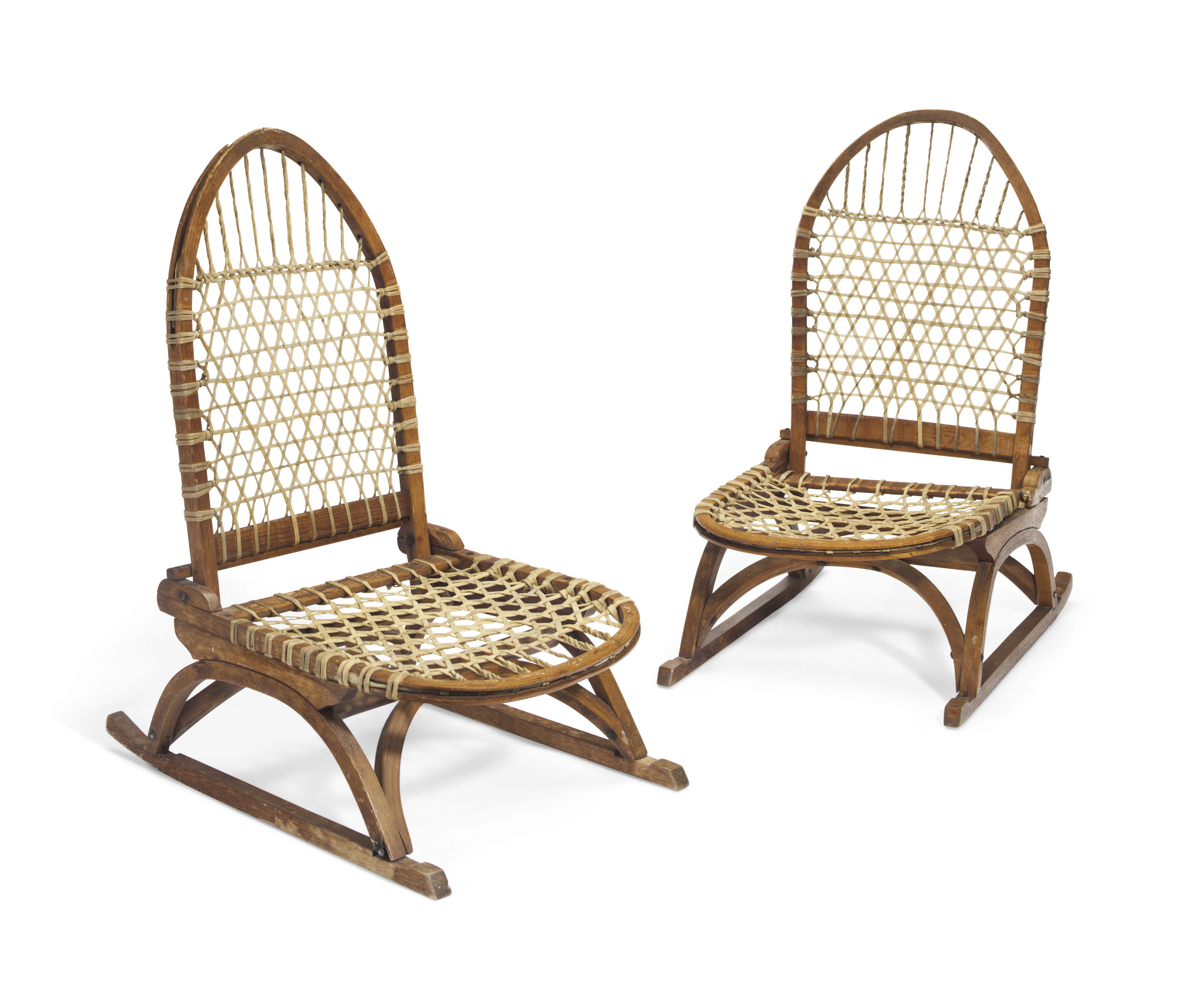 A PAIR OF NORTH AMERICAN PORTABLE SNOWSHOE CANOE CHAIRS , MANUFACTURED
