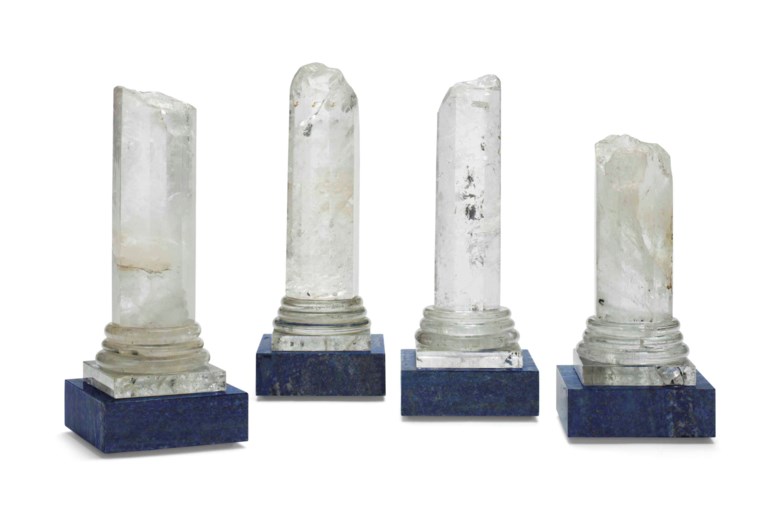 A set of four rock crystal and lapis lazuli columns. 12  in (30.5  cm) high, the tallest. Estimate $1,500-2,500. Offered in Interiors New York Visions on 6 June at Christie’s in New York