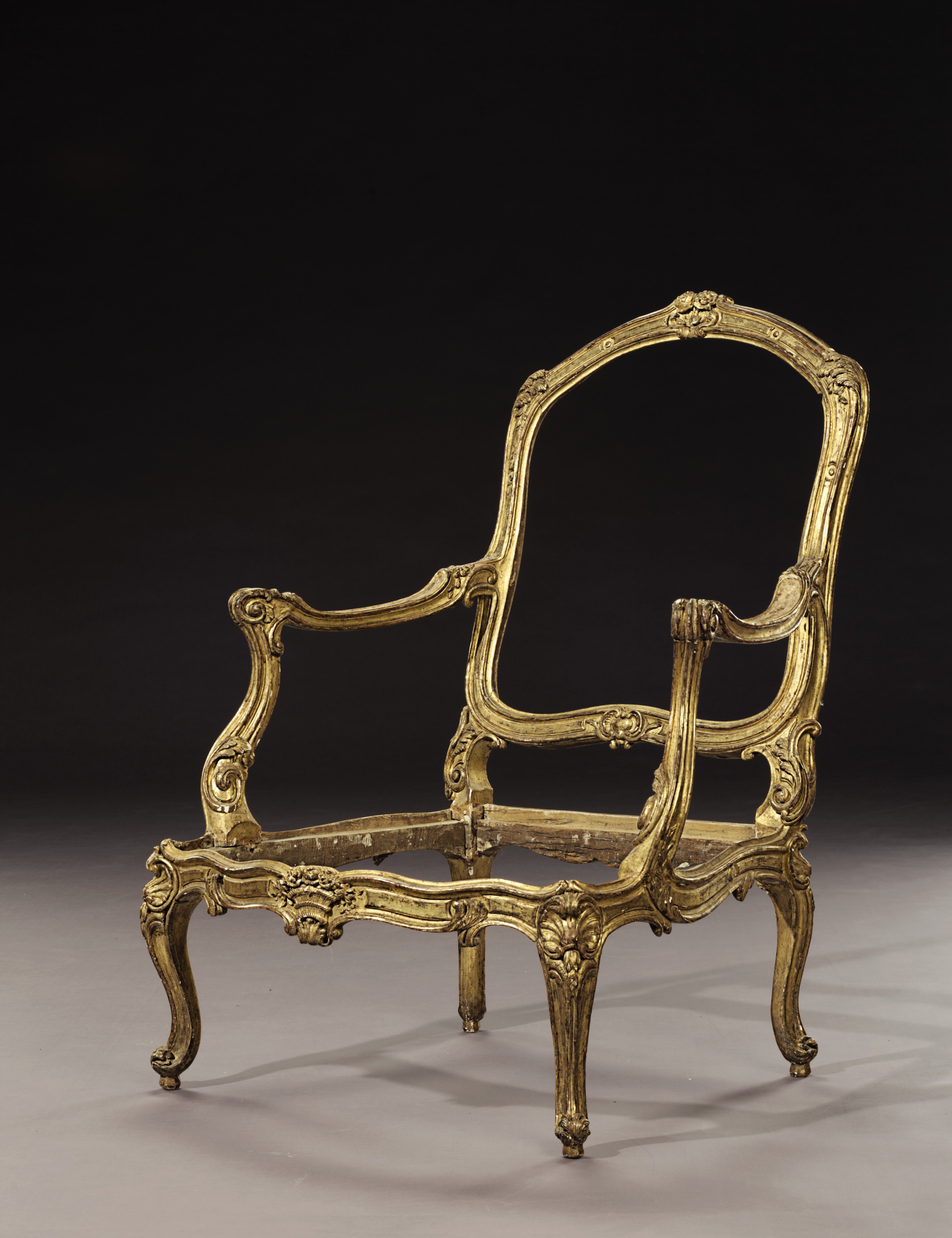 A Pair Of Louis Xv Giltwood Fauteuils By Jean Baptiste Tilliard