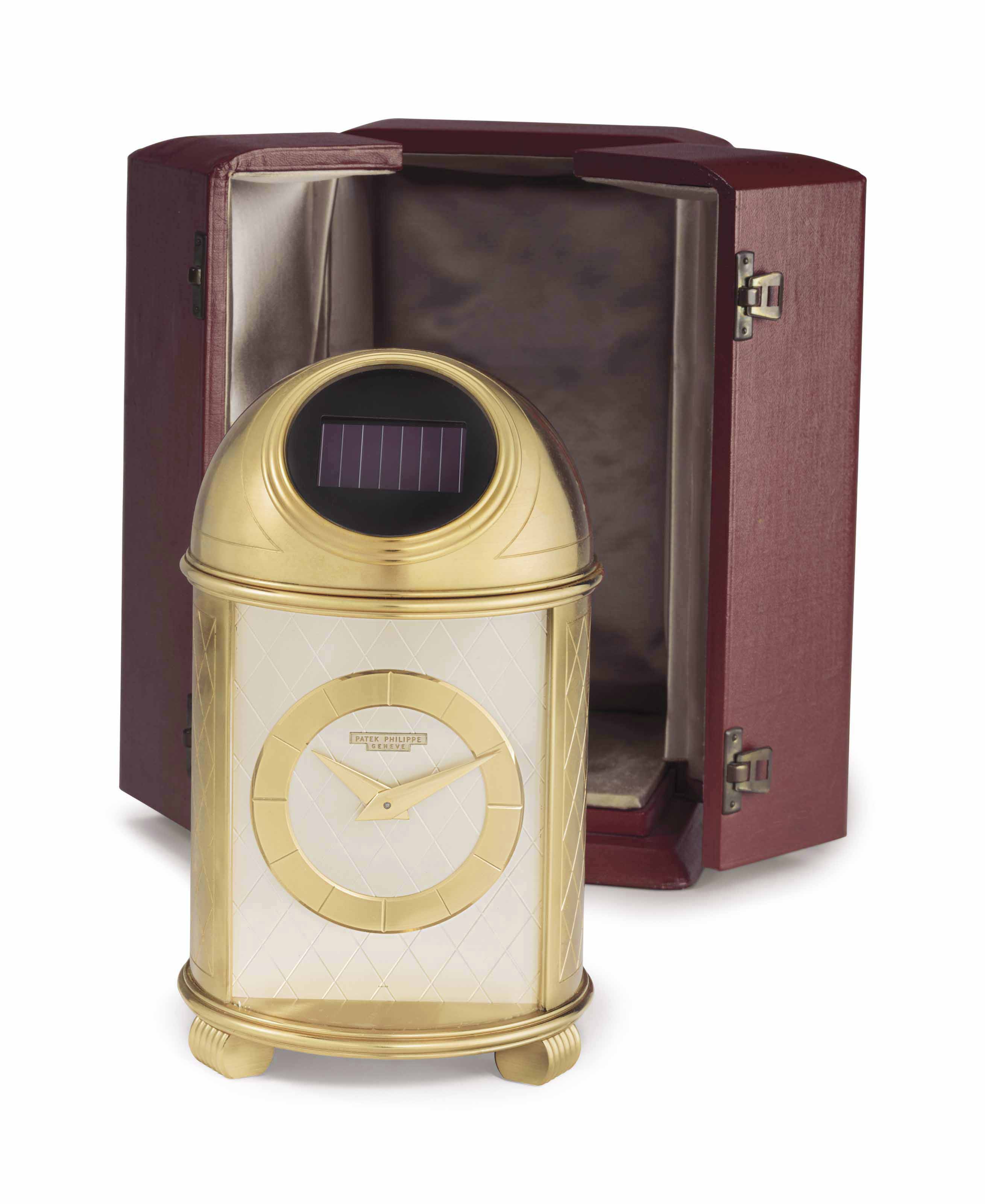 Patek Philippe. A Fine and Very Rare Gilt Brass SolarPowered Dome