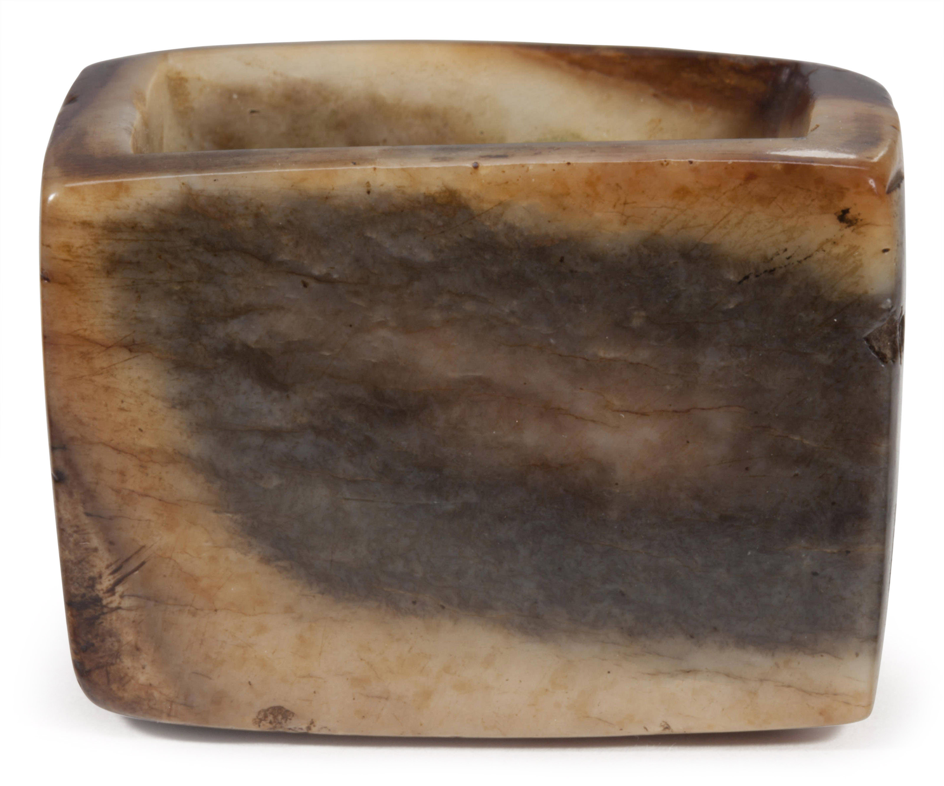 A MOTTLED BROWN JADE VESSEL, Christie’s