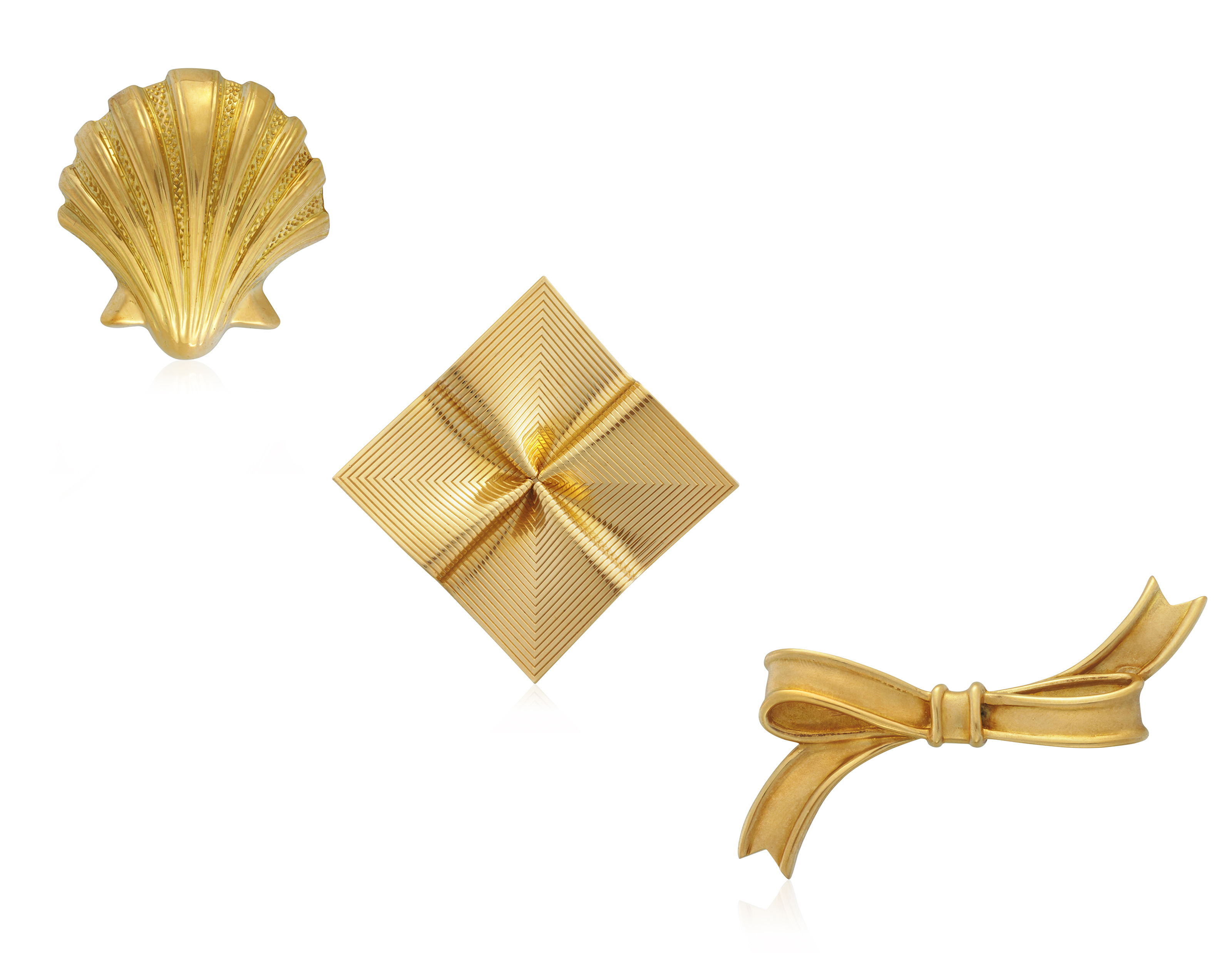TIFFANY & CO. GROUP OF GOLD BROOCHES, Christie’s