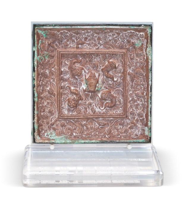 A SMALL CHINESE SILVERBACKED SQUARE BRONZE MIRROR