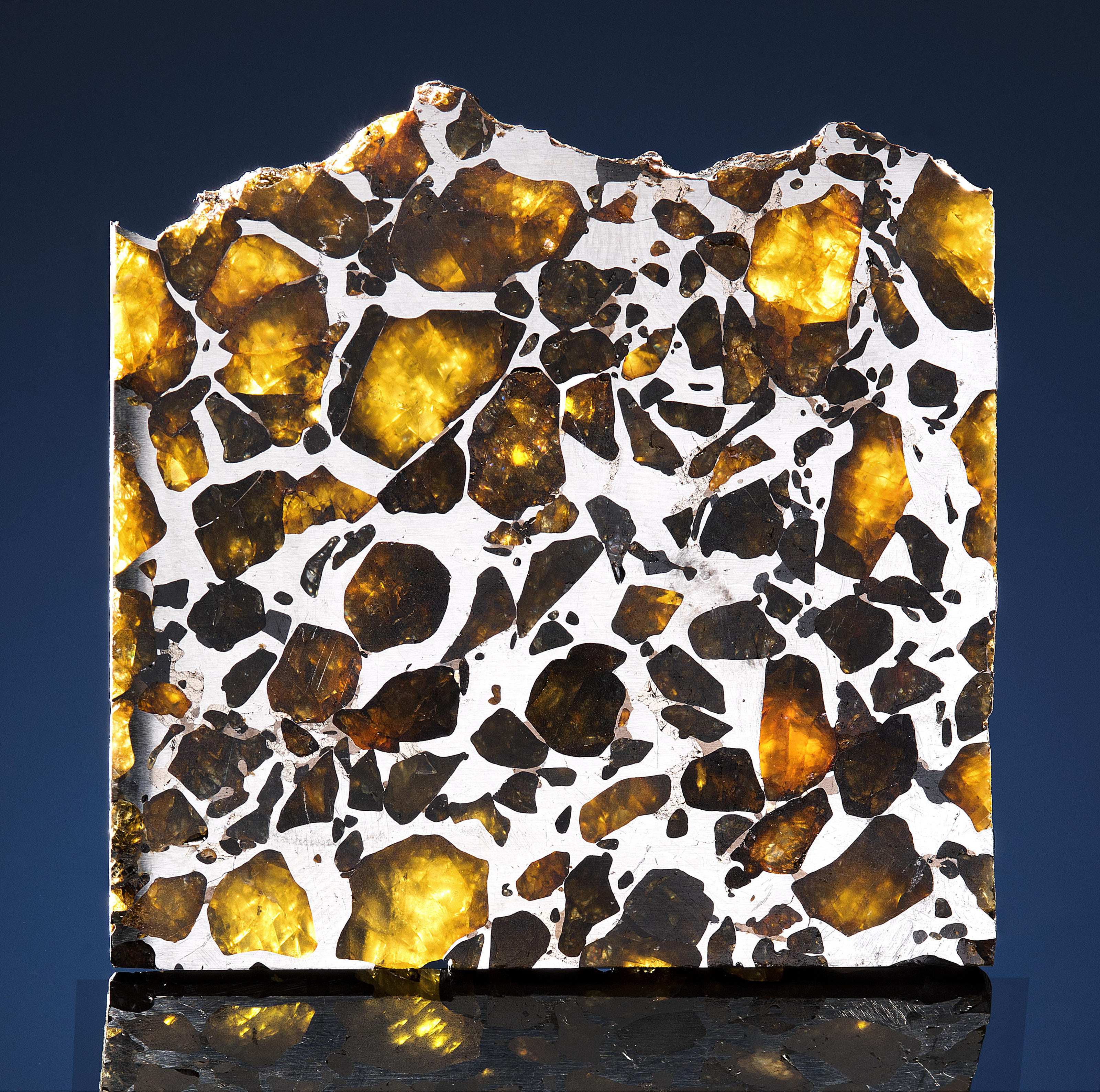 Stony Iron. Pallasite Olivine / Peridot from Atacama Desert, Chile. Image: Christies