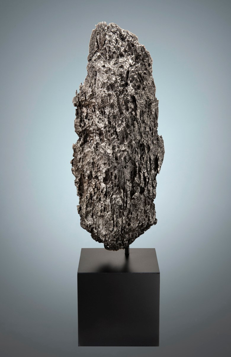 Exotic Dronino Meteorite — Extraterrestrial Monolithic Sculpture, Iron, ataxite (ungrouped) Ryazan district, Russia. 303 x 129 x 111mm (12 x 5 x 4⅓ in). Estimate $10,000-15,000. This lot is offered in Deep Impact Martian, Lunar and Other Rare Meteorites, 7-14 February 2018, Online