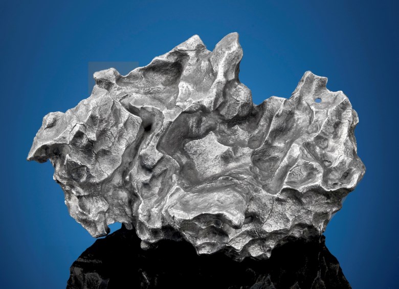 Sikhote Alin Meteorite With Naturally Formed Hole, Iron, coarsest octahedrite – IIAB Maritime Territory, Siberia, Russia. 88 x 163 x 119mm (3½ x 6 ⅓ x 4⅔in). Estimate $12,000-18,000. This lot is offered in Deep Impact Martian, Lunar and Other Rare Meteorites, 7-14 February 2018, Online