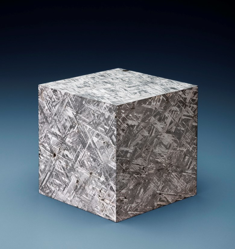 Large Muonionalusta Meteorite Cube — Crystalline Structure of an Iron Meteorite Dramatized in Three Dimensions, Iron, fine octahedrite Kiruna, Sweden. 116 x 116 x 116mm (4½ x 4½ x 4½in). Estimate $20,000-30,000. This lot is offered in Deep Impact Martian, Lunar and Other Rare Meteorites, 7-14 February 2018, Online