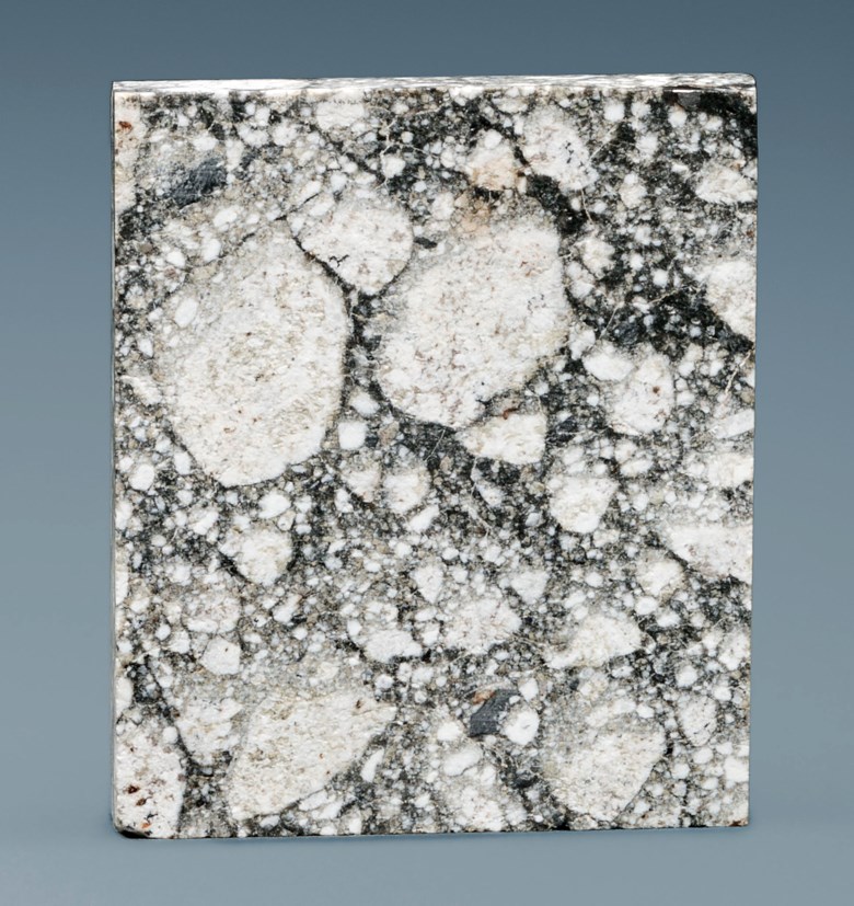 Partial Slice of Unique Lunar Meteorite — Nwa 5000, Gabbroic Brecccia from the Lunar Highlands Northwest Africa. 24 x 23 x 4mm (1 x 1 x ⅛in). Estimate $8,000-12,000. This lot is offered in Deep Impact Martian, Lunar and Other Rare Meteorites, 7-14 February 2018, Online