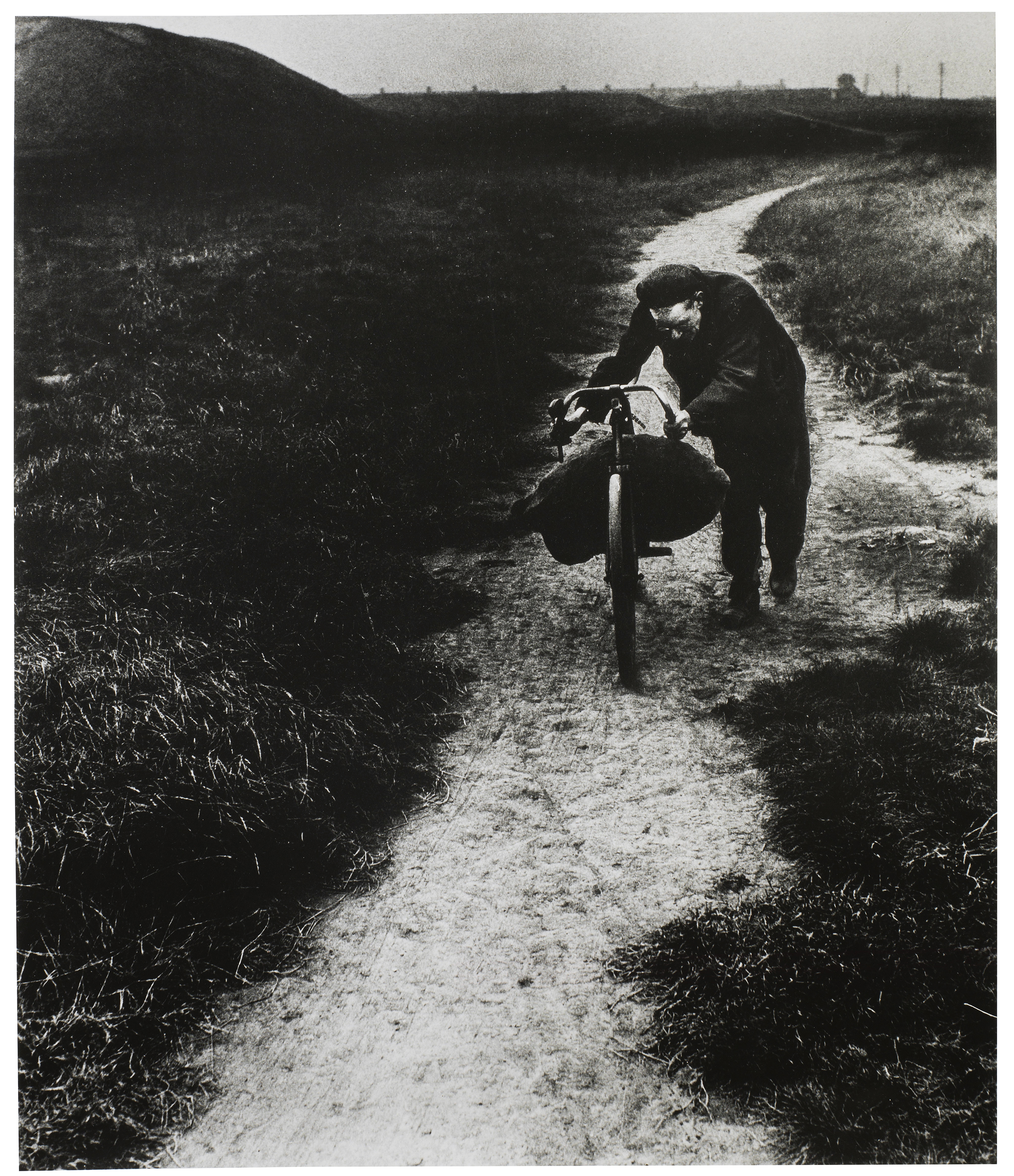BILL BRANDT (1904–1983), Coal-searcher going home to Jarrow, 1937