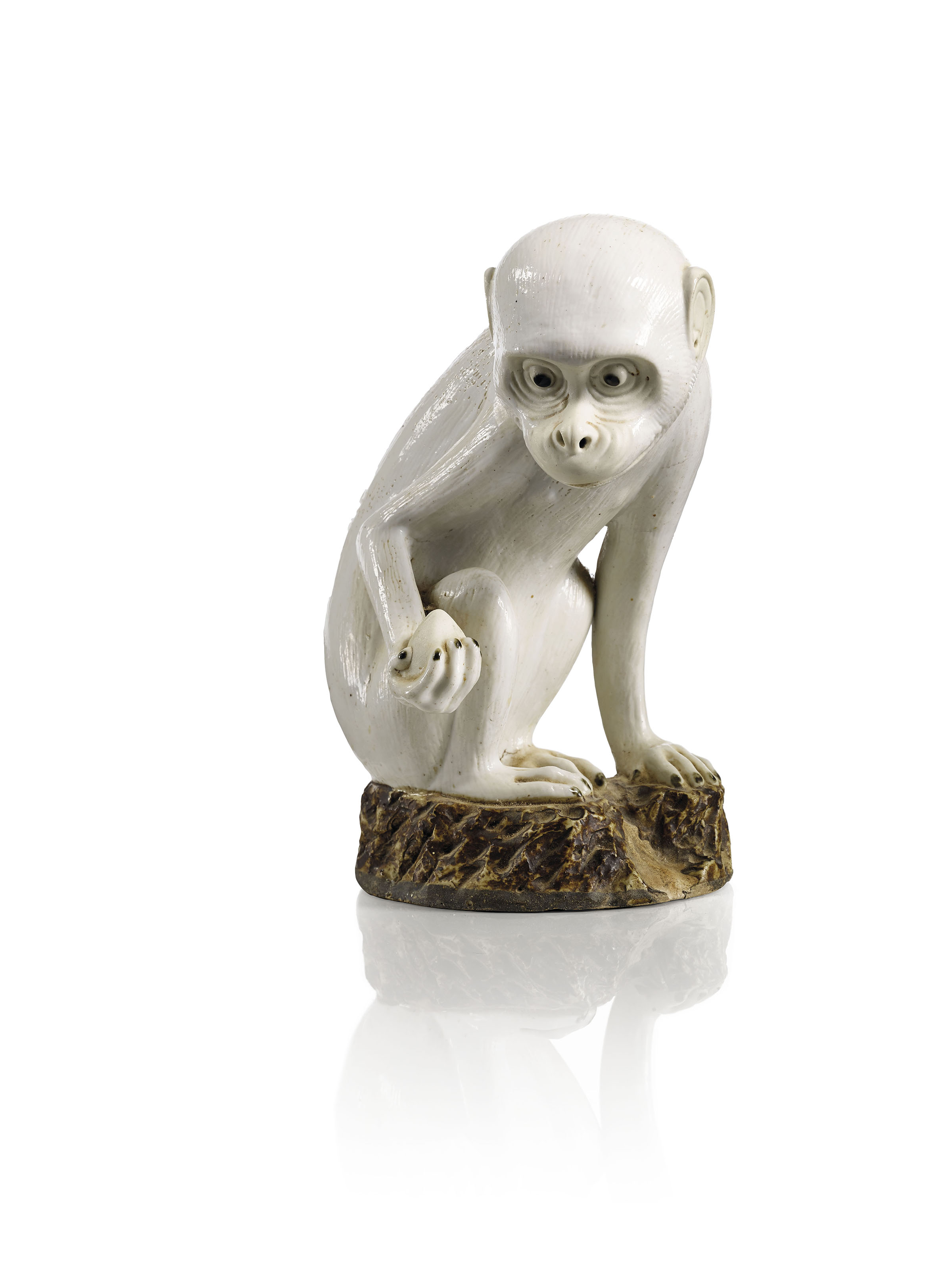 A white and brown-glazed biscuit figure of a monkey,&nbsp;China, Qing dynasty, Qianlong period (1736-1795). Height: 22  cm (8&frac34;  in). Sold for &euro;112,500 on 13 June 2018 at Christie&rsquo;s in Paris