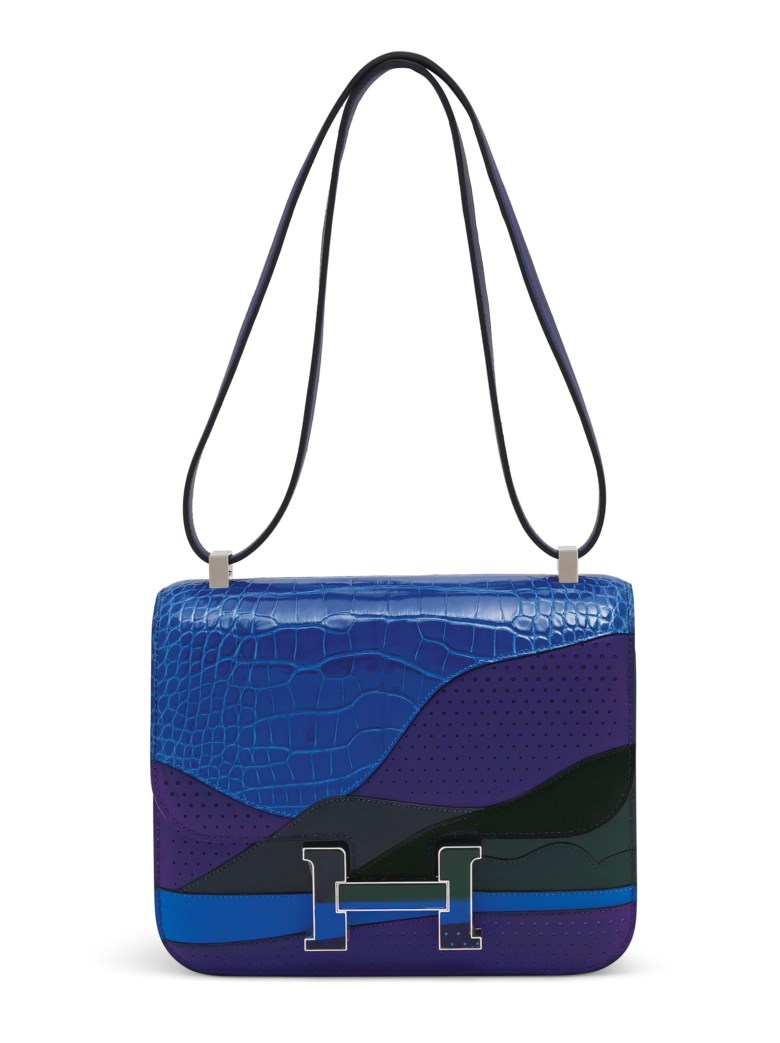 A limited edition bleu encre, bleu zellige, vert cyprès & bleu nuit, shiny alligator & niloticus lizard “Au Bout Du Monde” Constance 24 with palladium hardware, Hermès, 2018. 24 w x 19 h x 7 d cm. Sold for £35,000 on 11 June 2019 at Christie’s in London