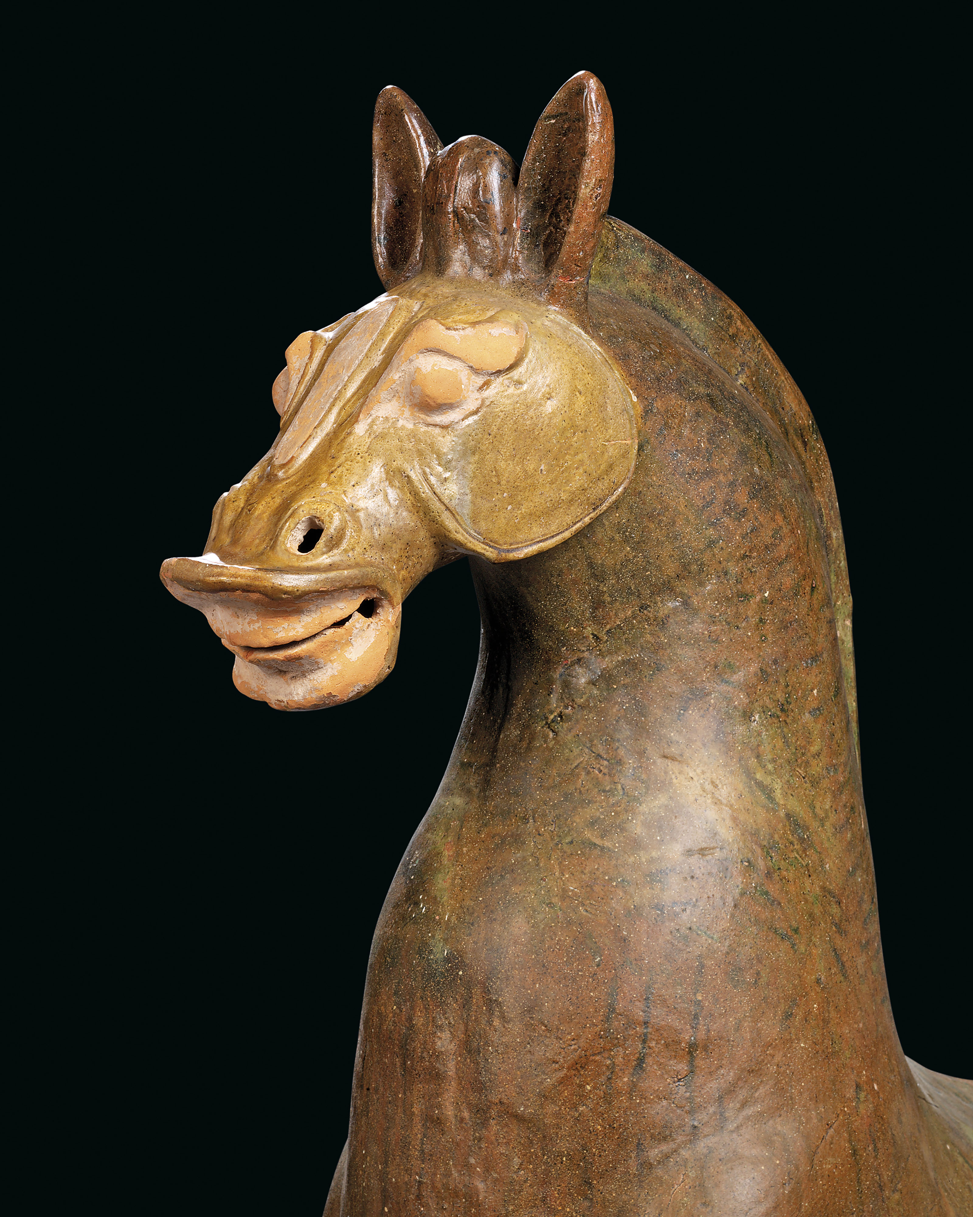 A LARGE BROWN AND GREENGLAZED POTTERY FIGURE OF A HORSE AND A CARRIAGE