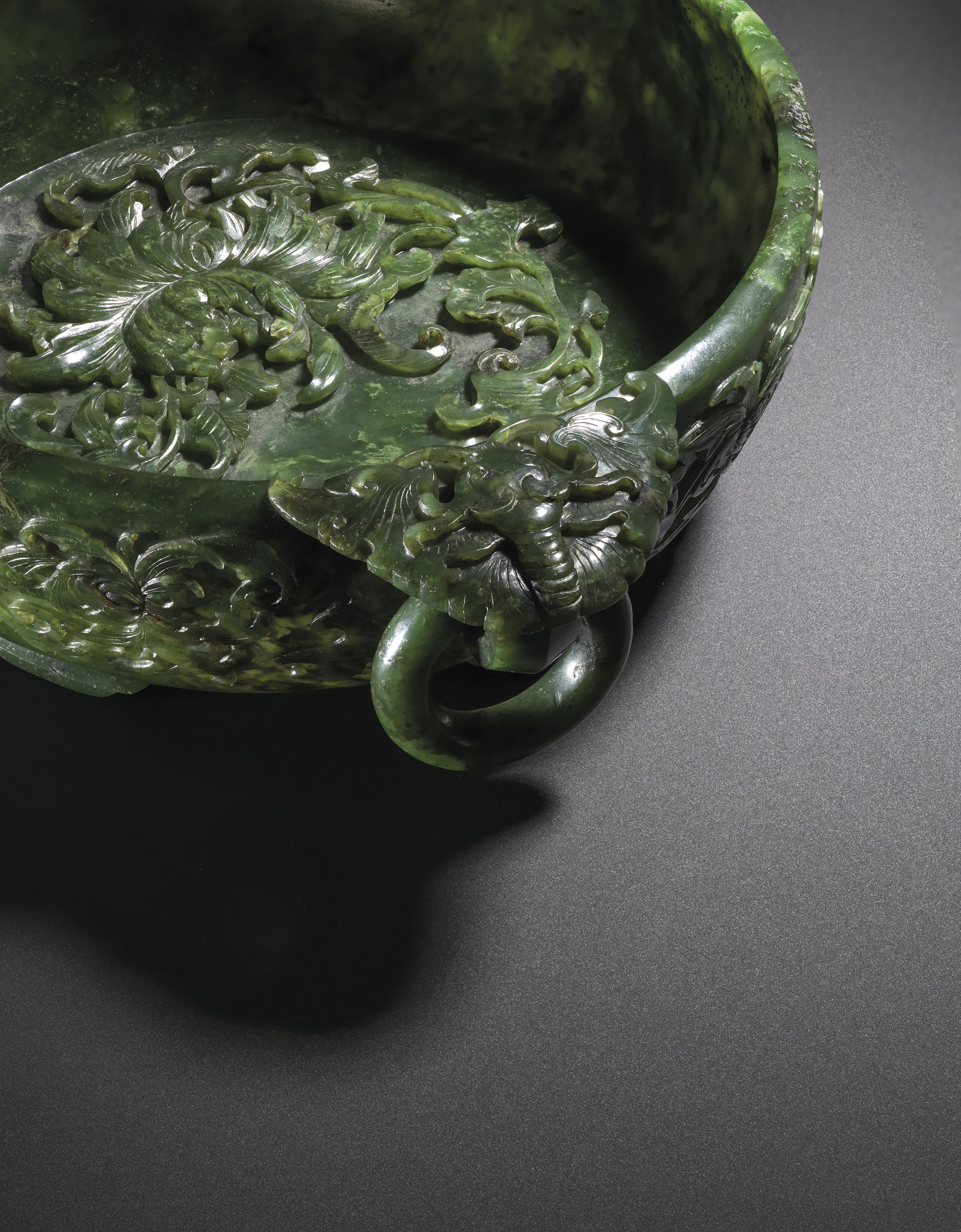 A FINELY CARVED SPINACHGREEN JADE 'MARRIAGE BOWL' , QIANLONG PERIOD